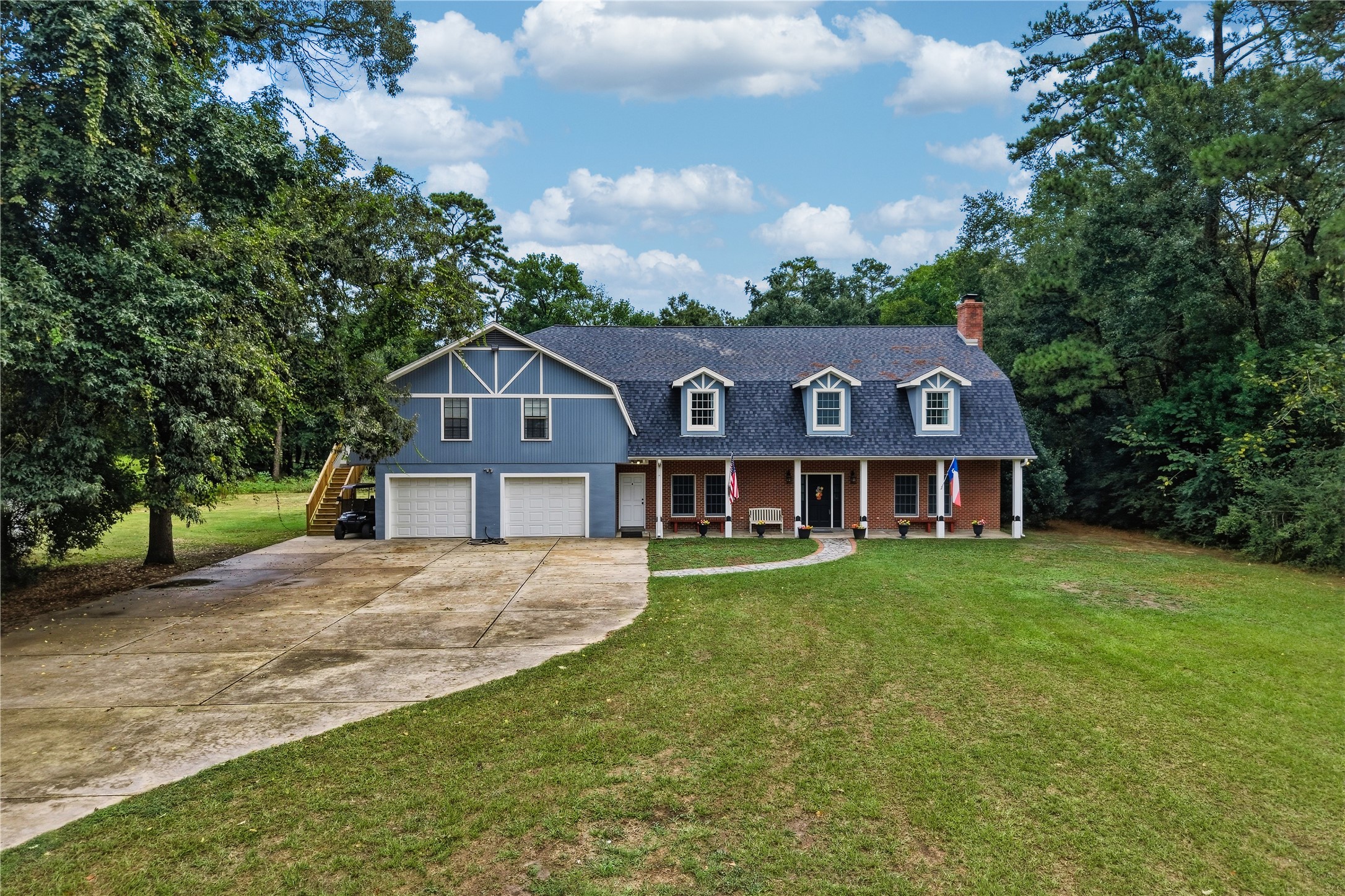 Enjoy peaceful country living on this beautiful, sprawling two-acre property.