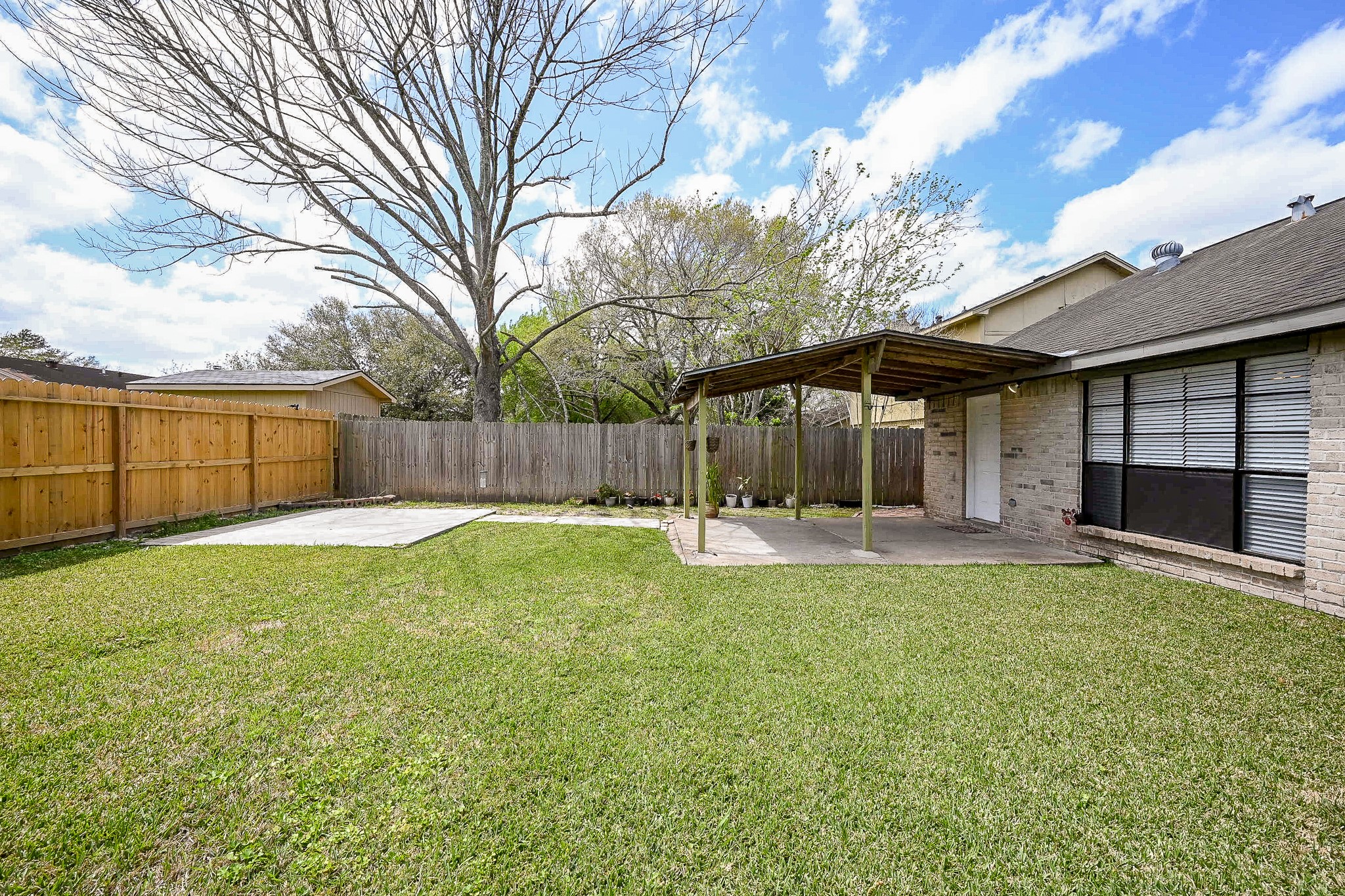 Spacious backyard and covered patio and