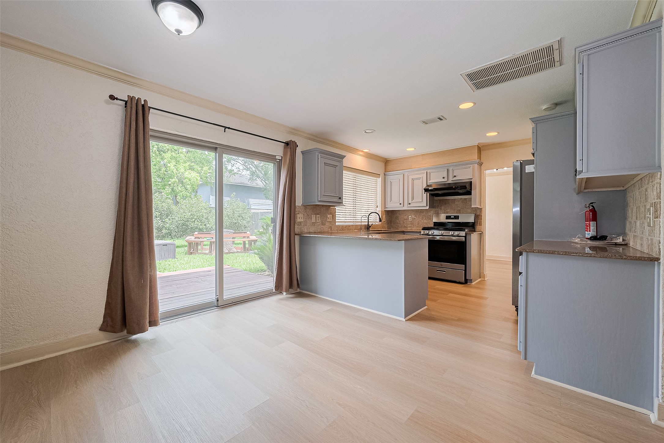 Kitchen with sliding doors to backyard