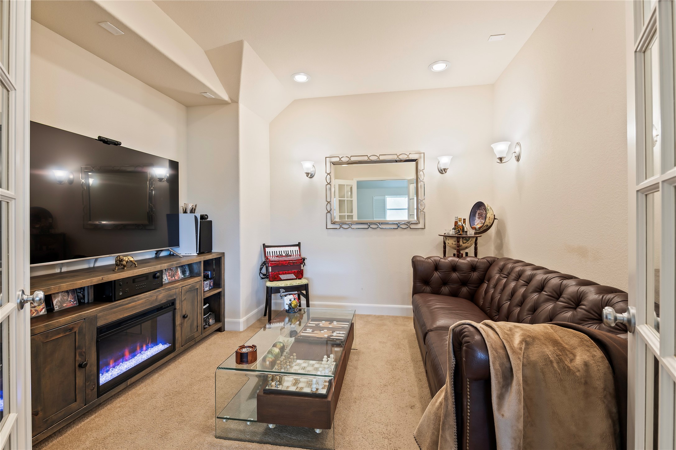 Media room features French doors and 5.1 surround sound wiring.