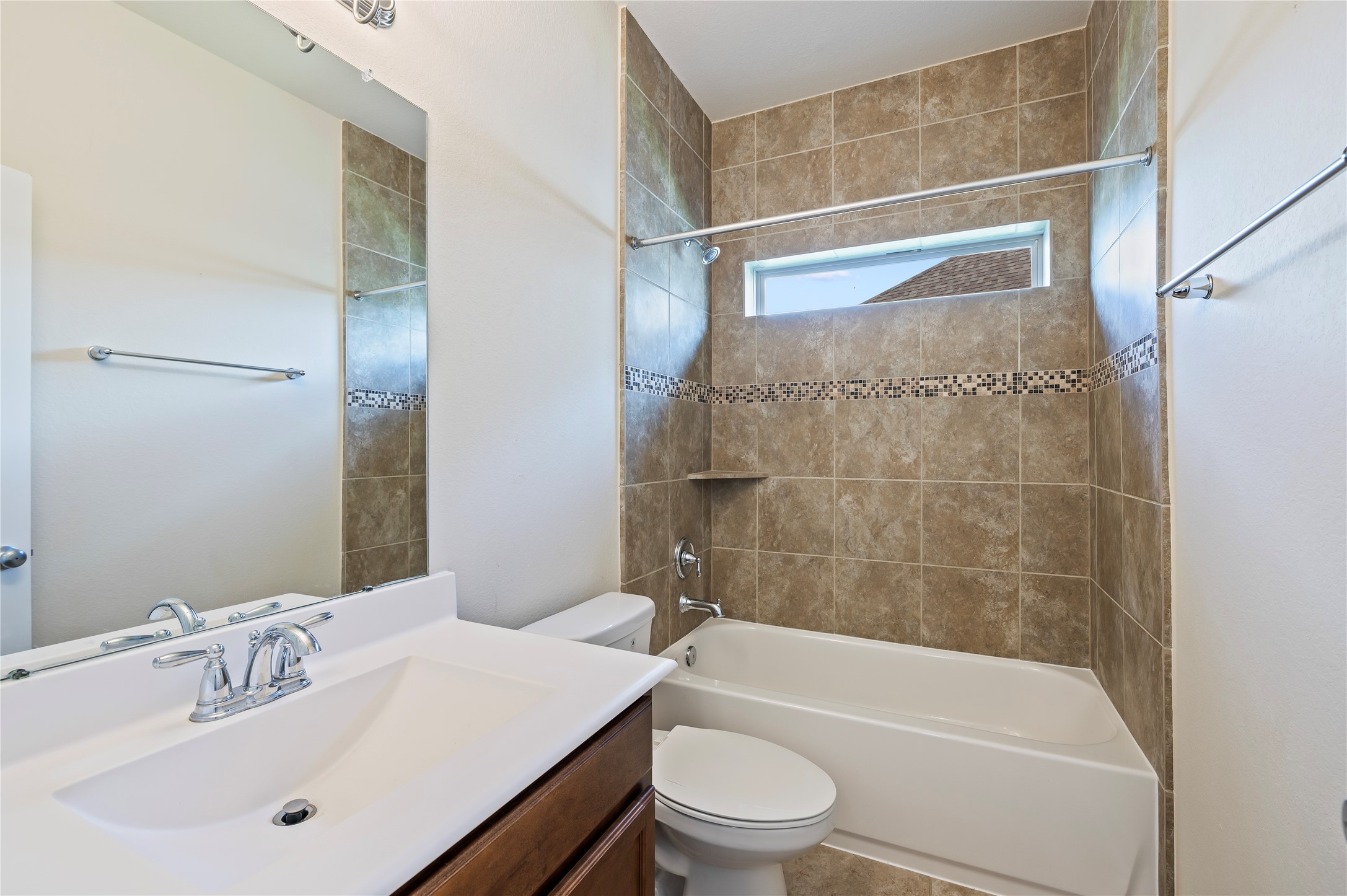 Full bathroom downstairs with tub/shower combination. Ceramic tile and grout recently professionally cleaned upon seller's move out.