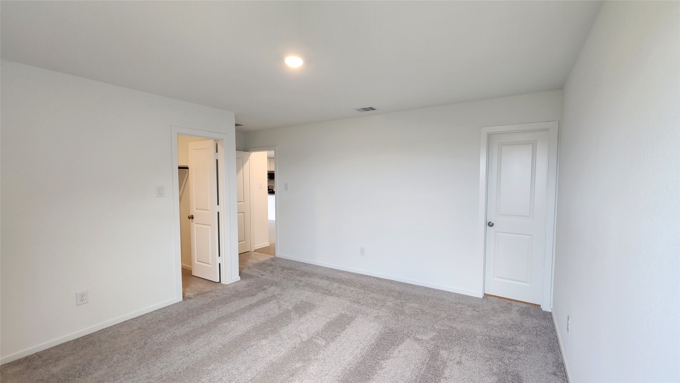 Master bedroom to walk-in closet