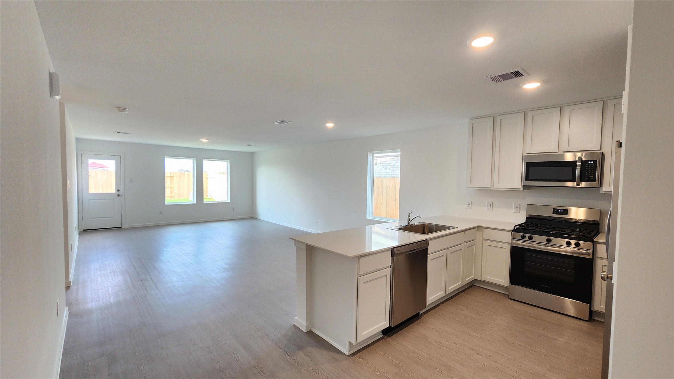 Kitchen to Dining and Family room Kitchen to Dining and Family room