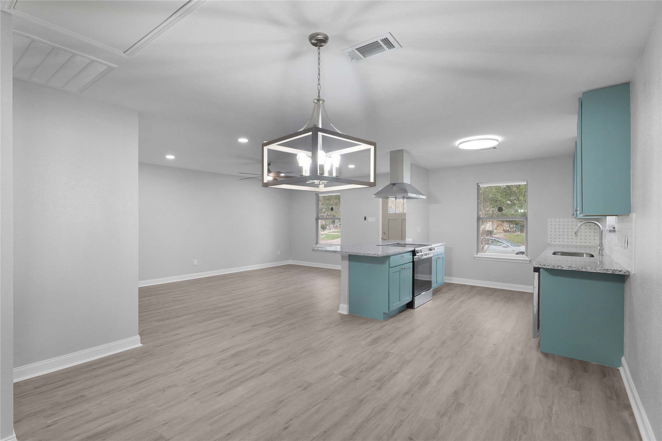 An open layout connects the dining area, living room, and kitchen, keeping everyday activities and gatherings together.