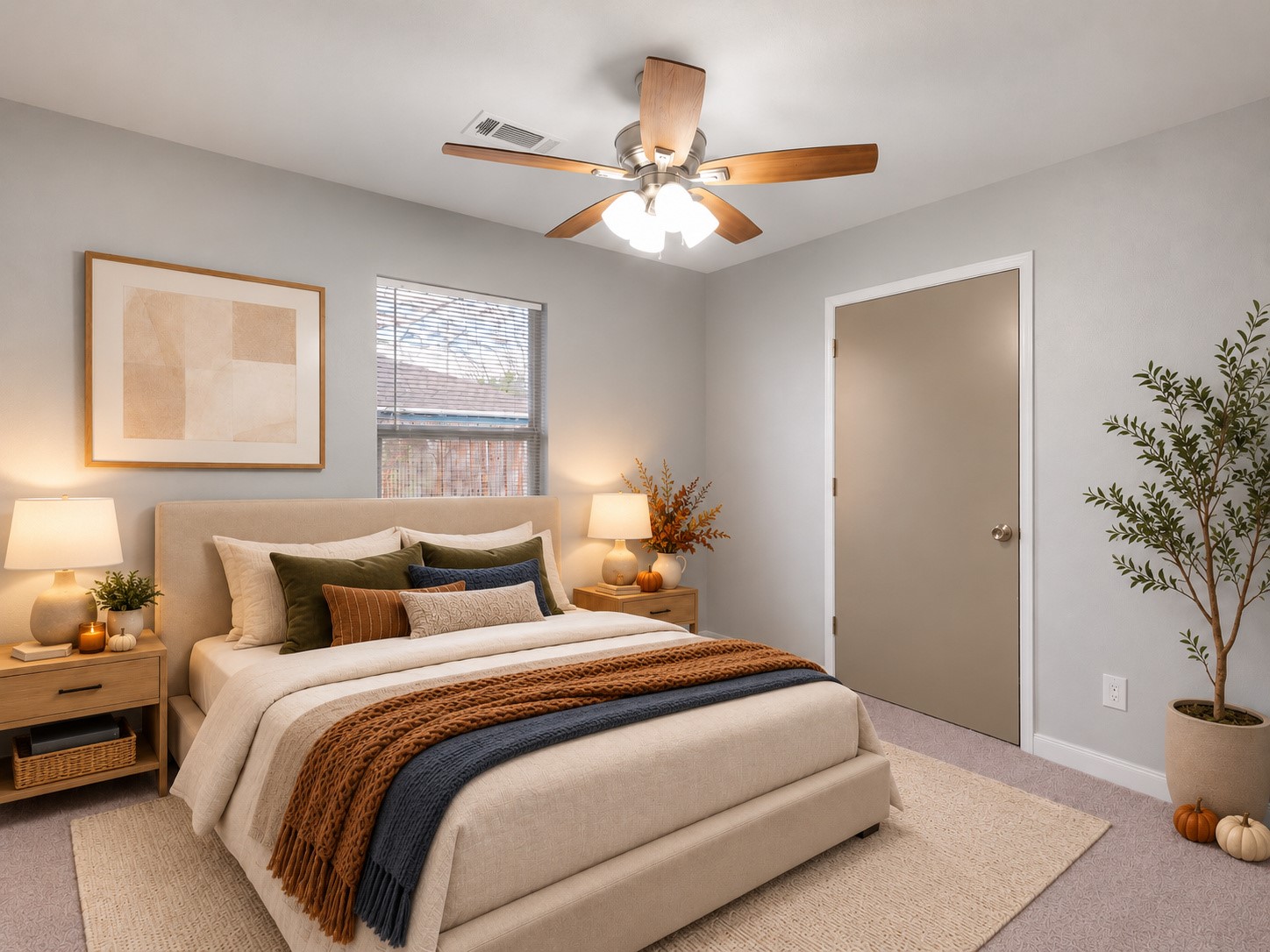 Secondary bedroom featuring neutral finishes, a ceiling fan, and natural light. Digitally staged.