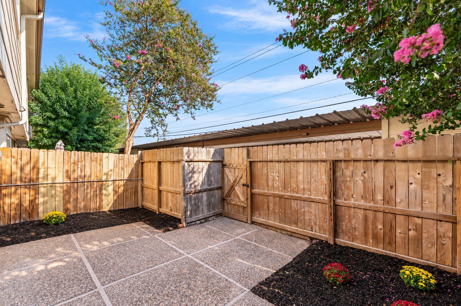 The patio has had a new door and fresh landscaping.