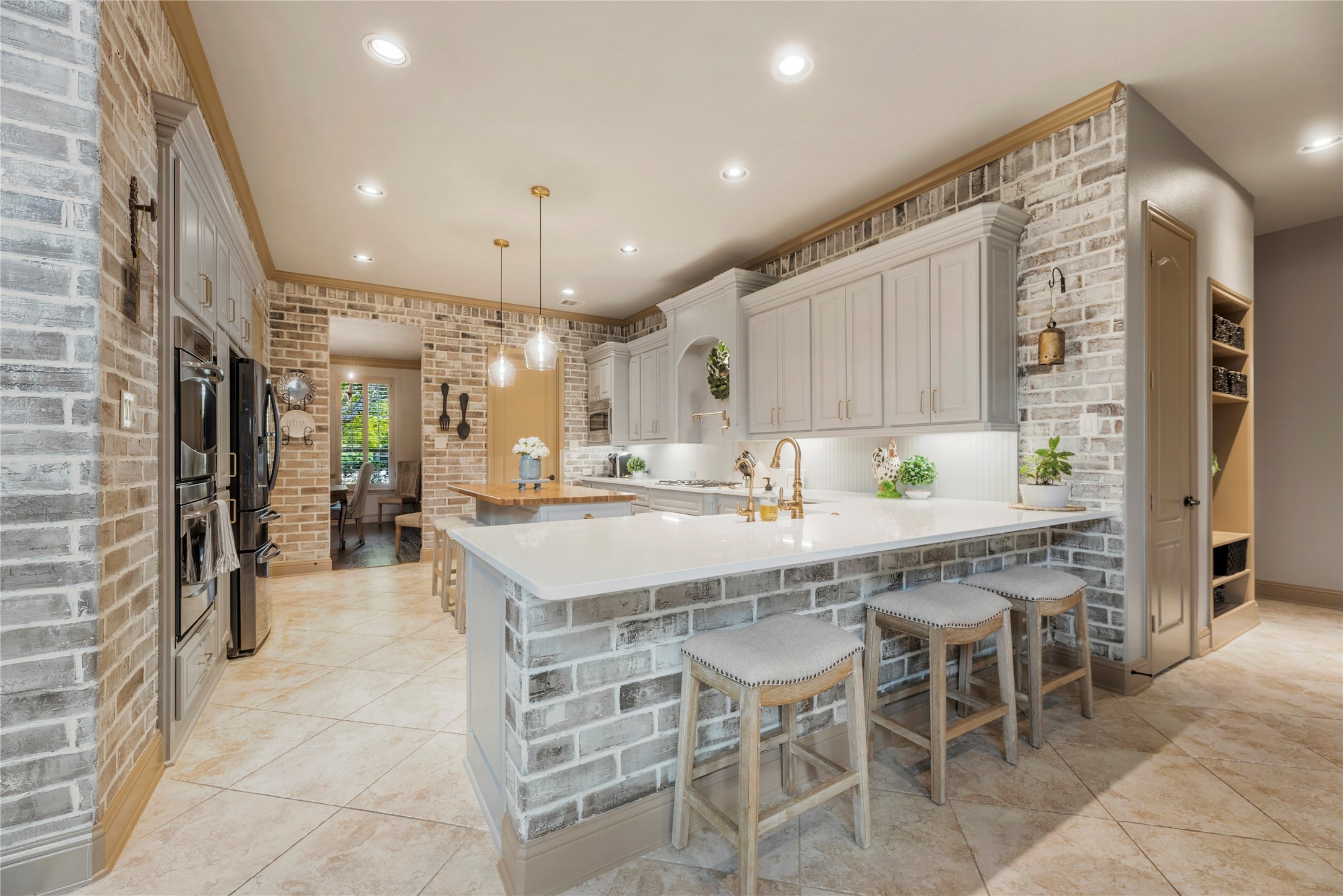 Beautiful kitchen with a large center island, custom cabinetry, and an open layout ideal for cooking and gathering.