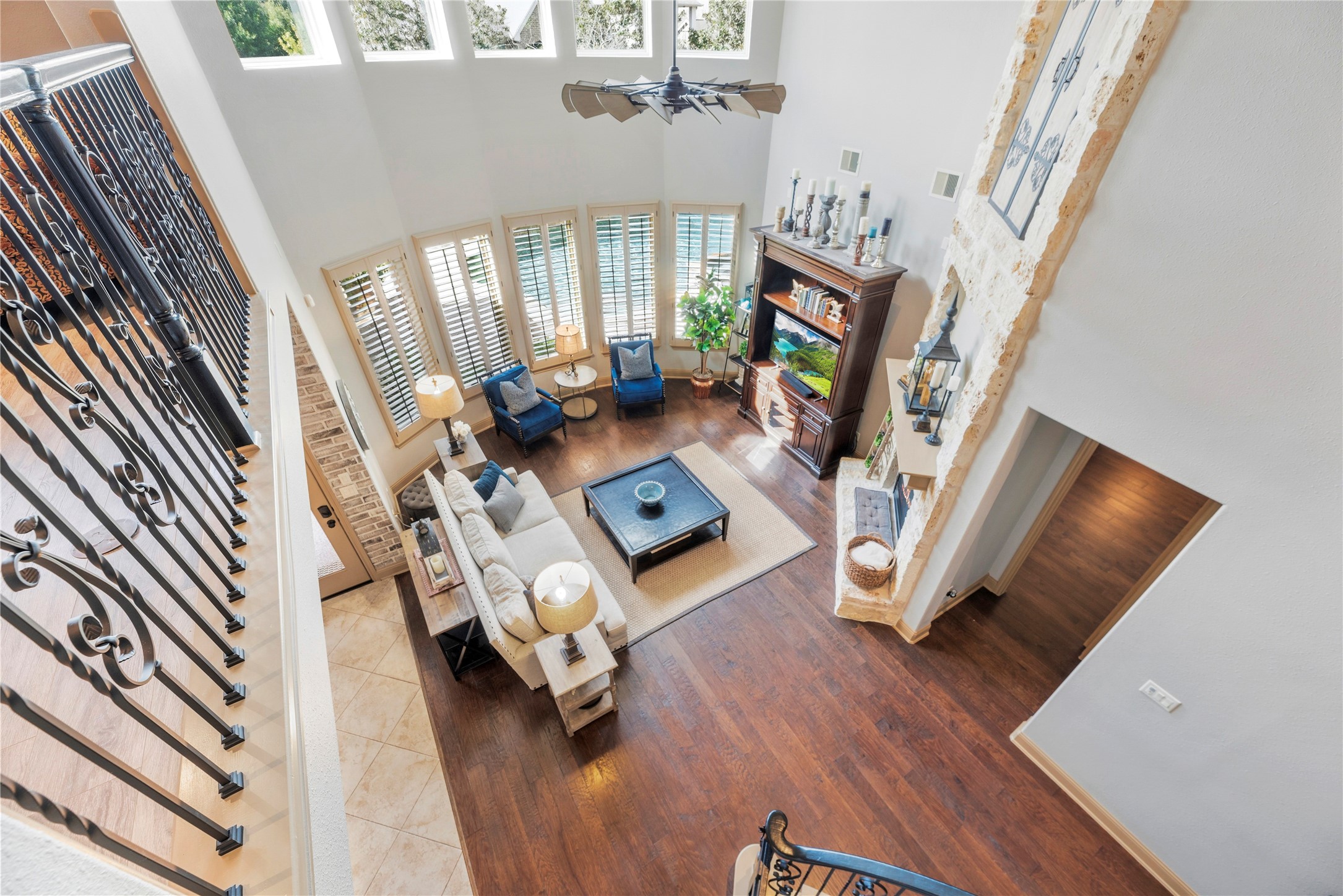 Beautiful overhead view of the living room, showcasing the soaring ceilings, open layout, and impressive architectural details.