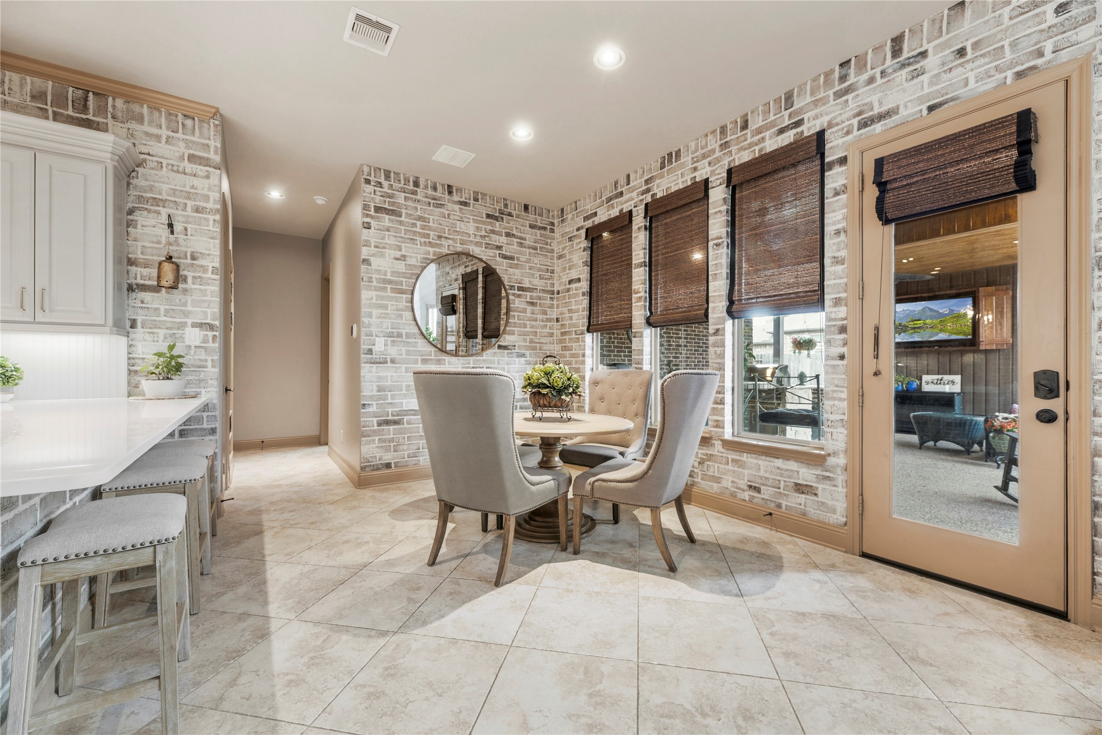 Spacious breakfast area overlooking the back porch.
