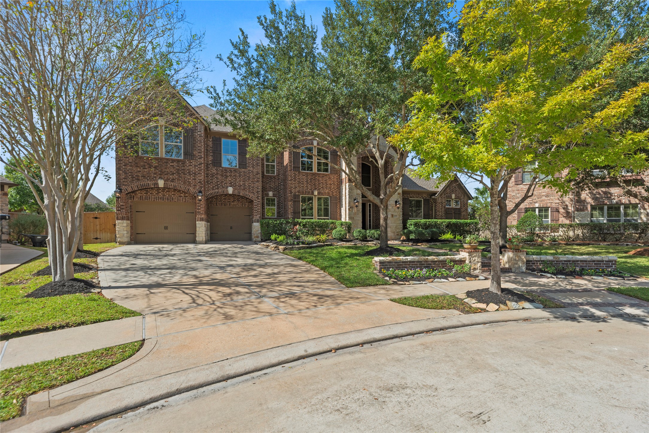 Beautiful two-story brick home in a cul-de-sac with a spacious driveway, and inviting curb appeal.