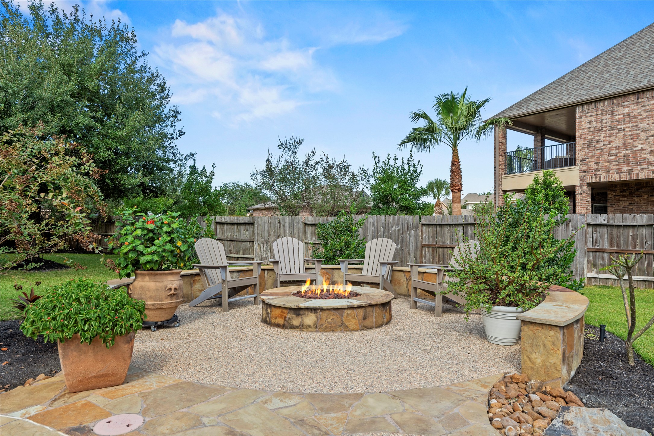 Inviting outdoor courtyard with a beautiful fireplace.