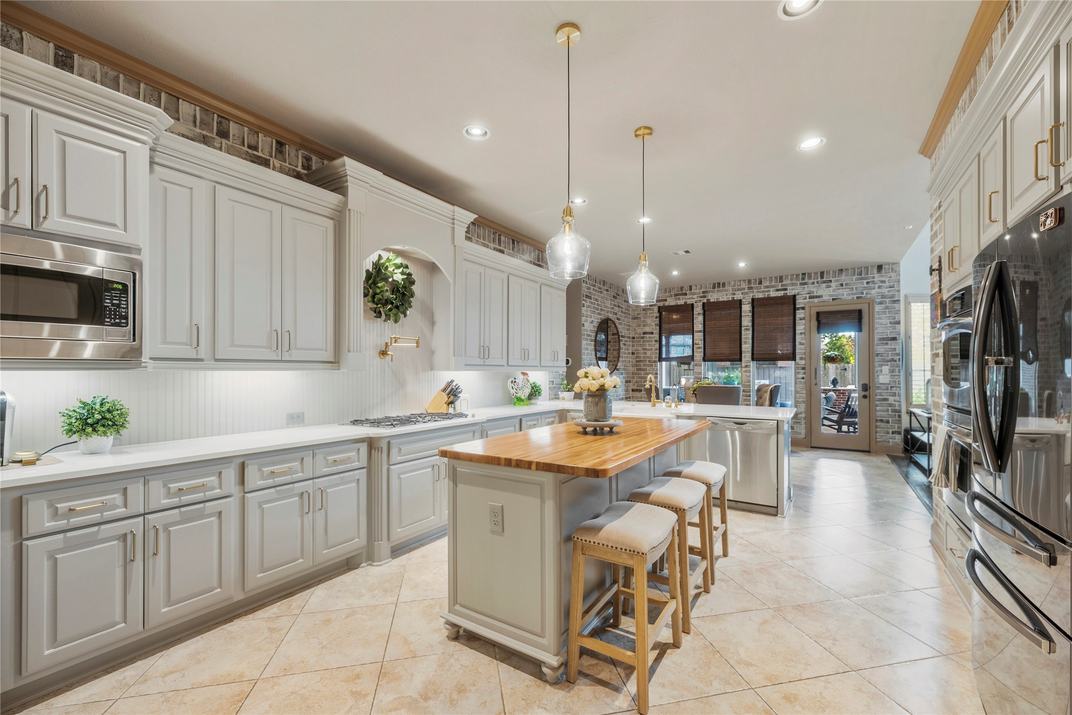 Bright kitchen featuring a spacious island and plenty of room for meal preparation.