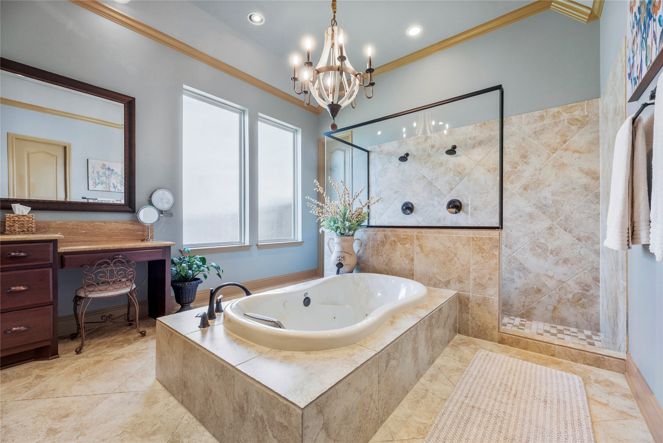Another angle of the primary bathroom, highlighting the soaking tub, spacious vanities, and beautiful natural light.