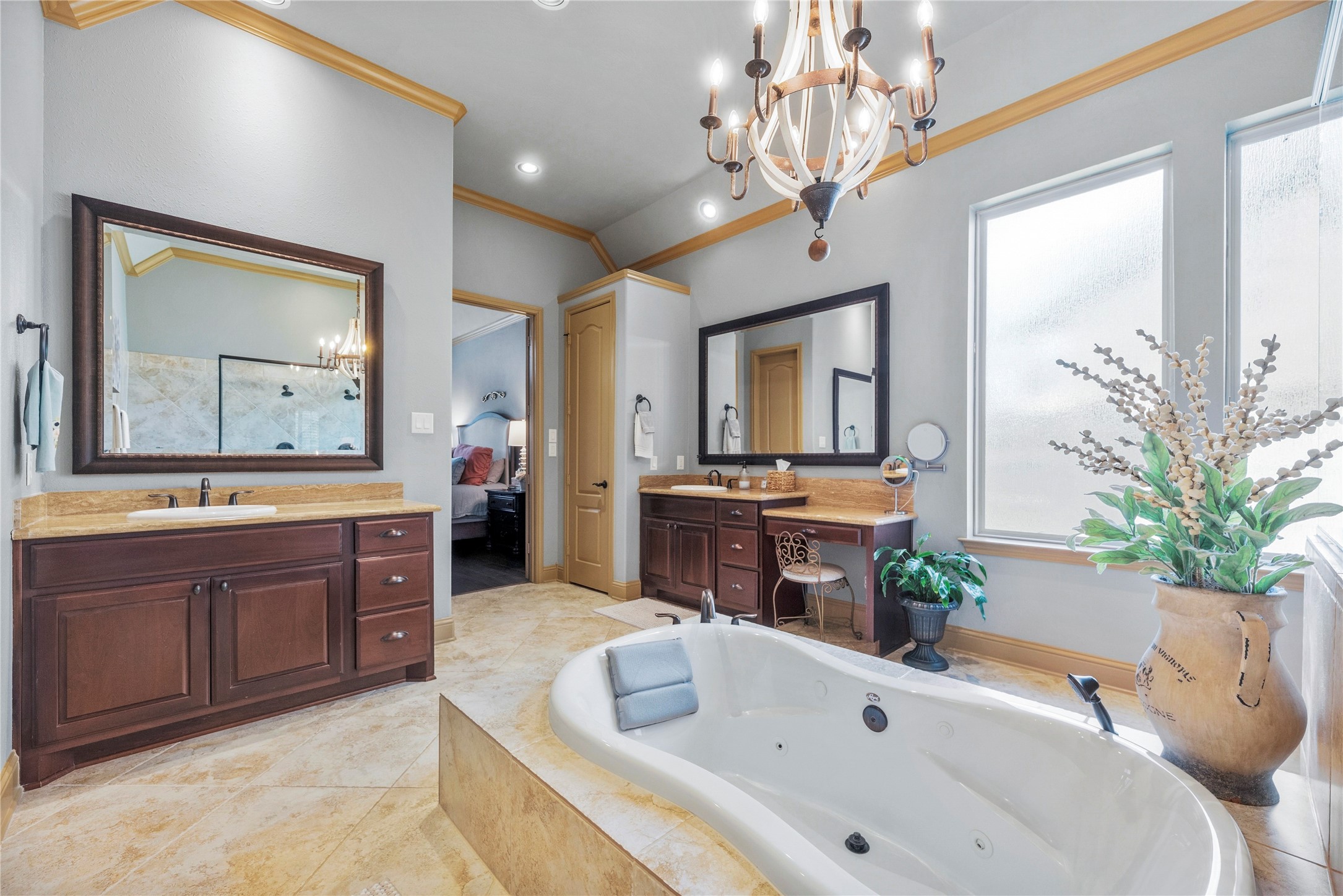 Elegant primary bathroom with a relaxing soaking tub, and generous counter space.