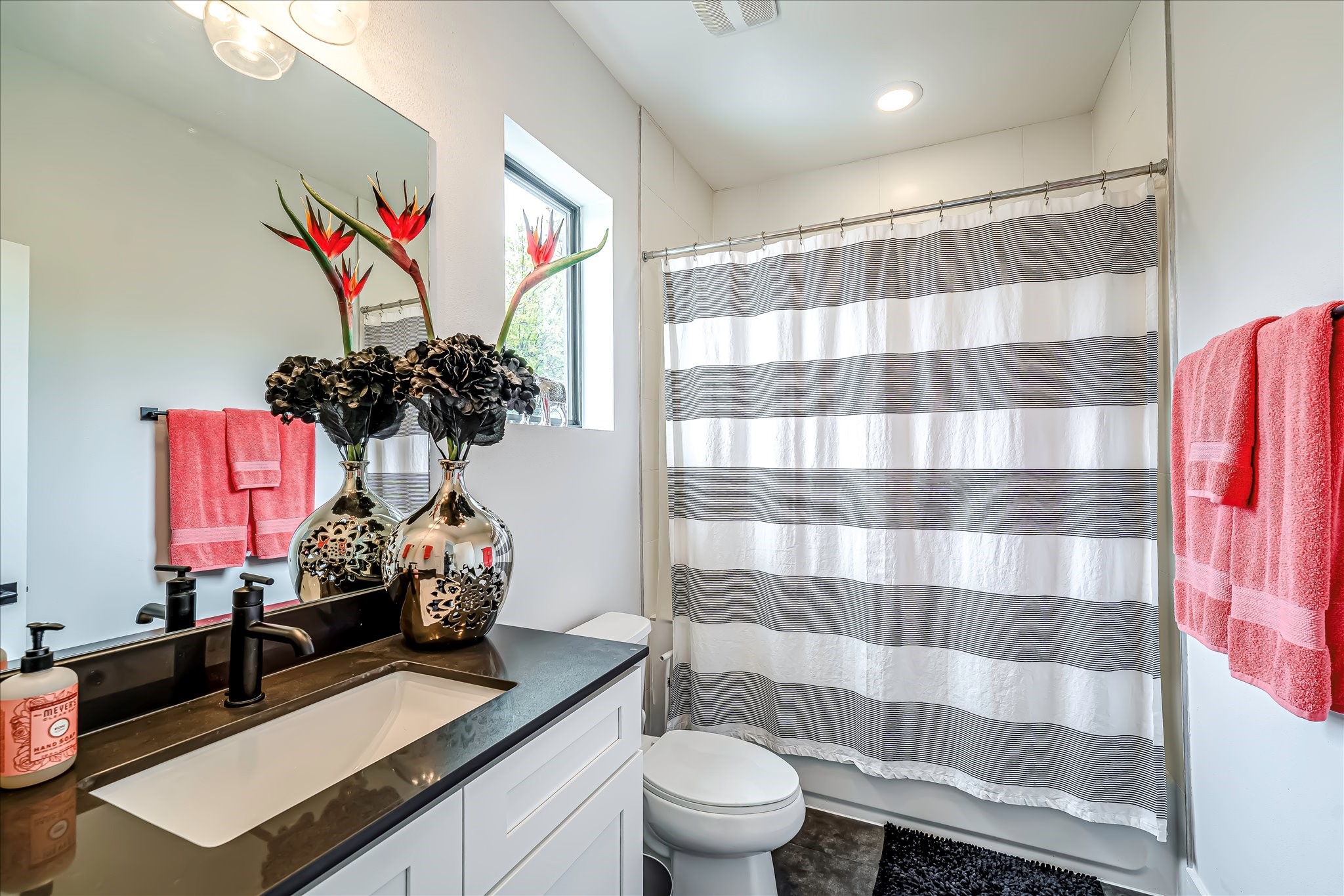 Well-appointed secondary bathroom designed with modern finishes and timeless style.