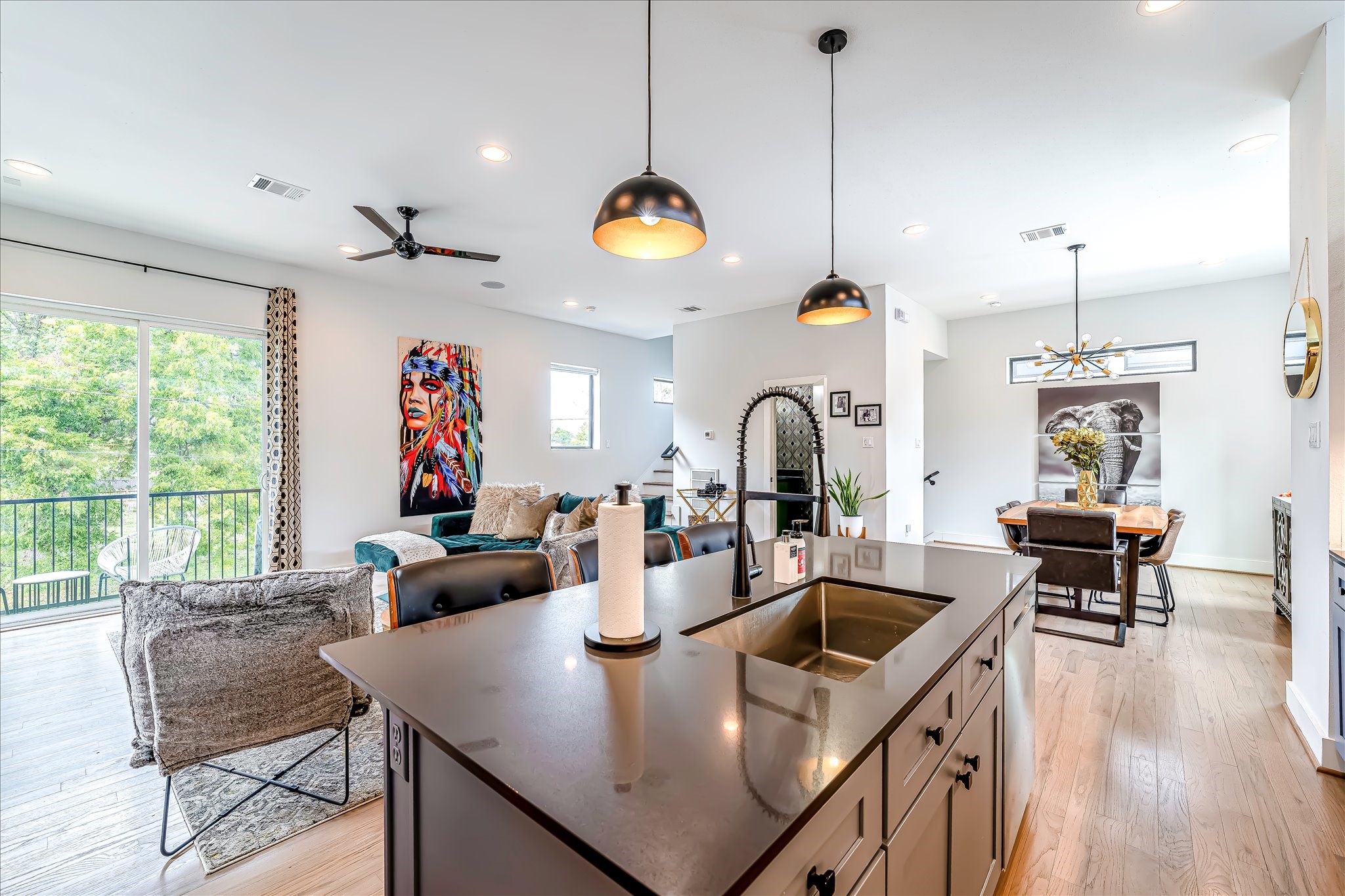 Large island creates the perfect gathering space for family, entertaining, and everyday living. Photos reflect previous furnishings. Home is currently vacant. Furnishings shown are for illustrative purposes only.