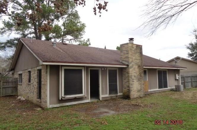 Spacious backyard, and large windows offering plenty of natural light.