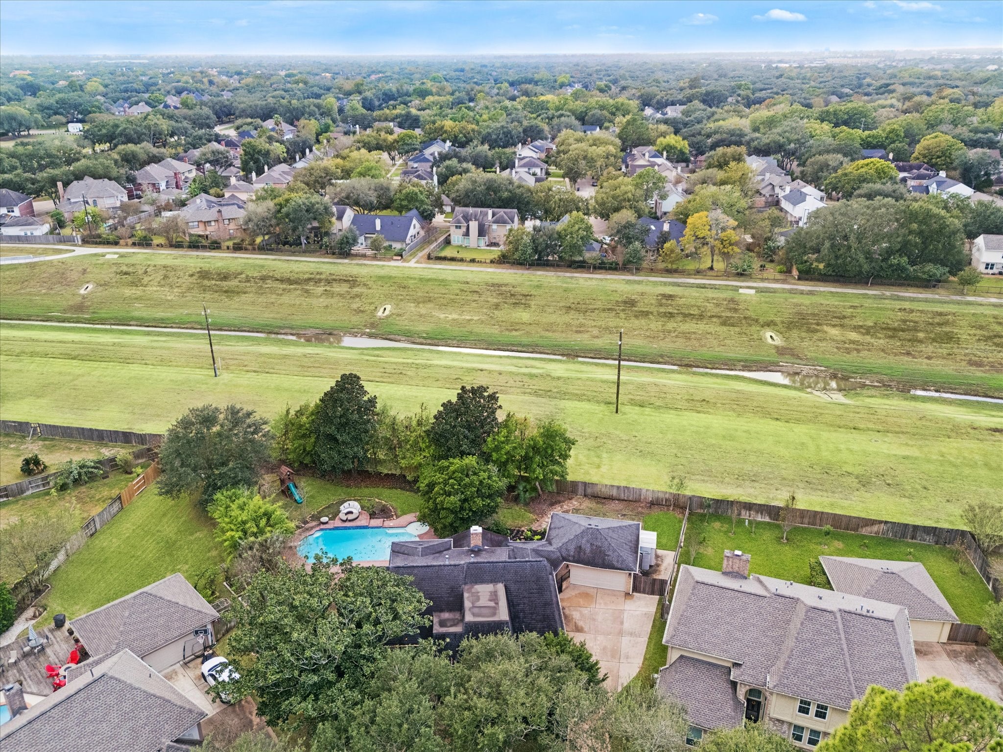 Enjoy true privacy as the property backs directly onto a wide, maintained greenway, ensuring no back neighbors and providing beautiful open views beyond the home's private backyard pool area.