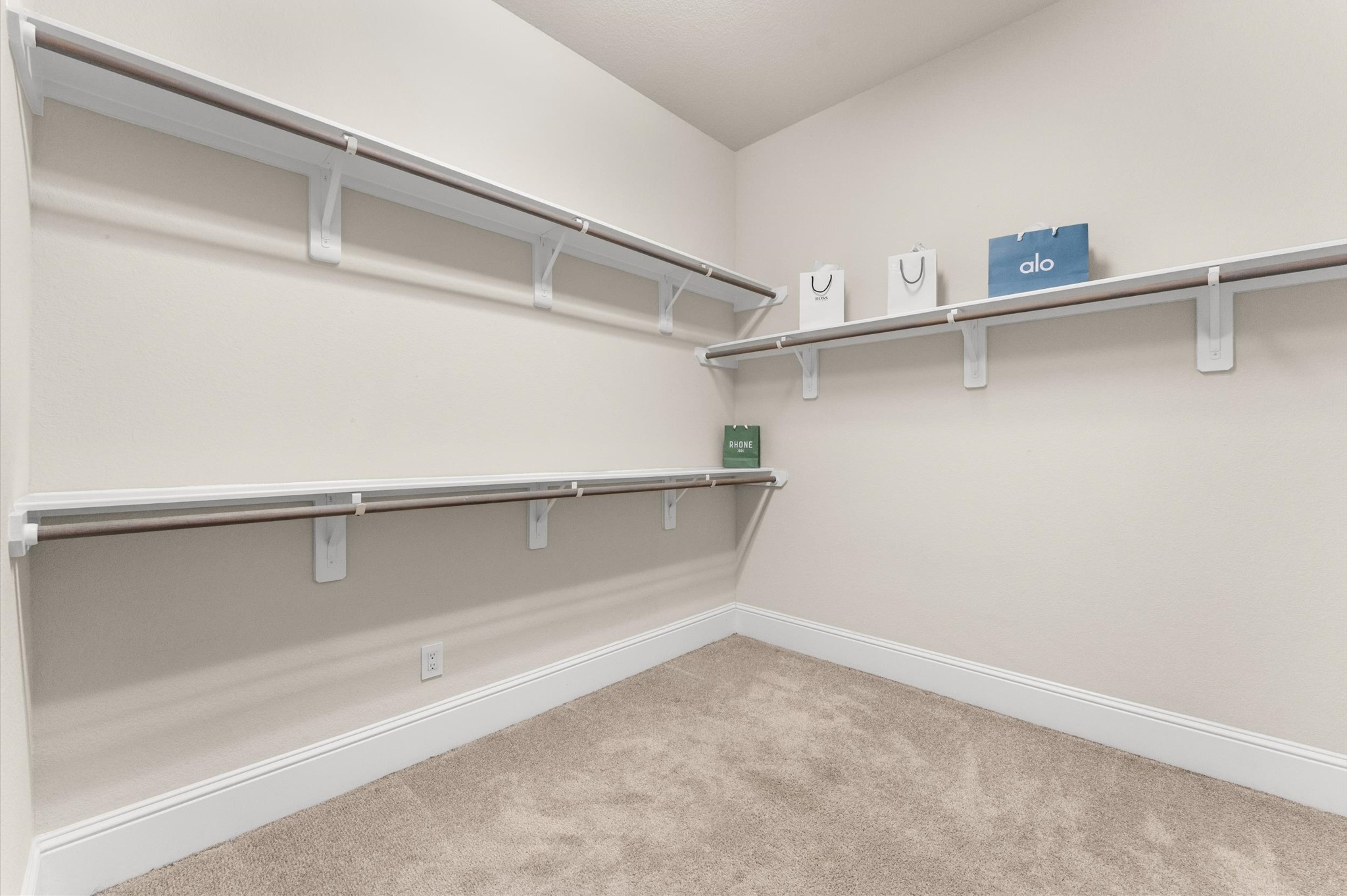 Primary bedroom features an expansive walk-in closet with convenient direct access to the laundry room.