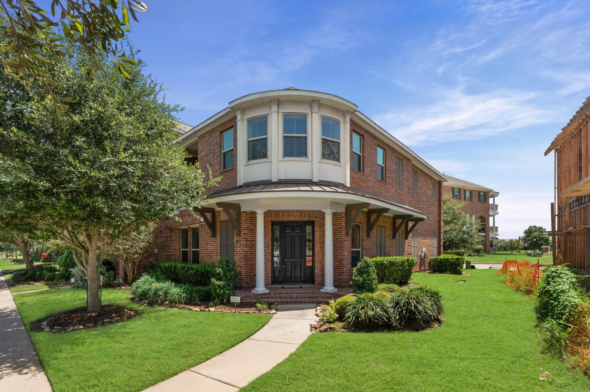 Stunning brick front elevation featuring an inviting and elegant entrance.