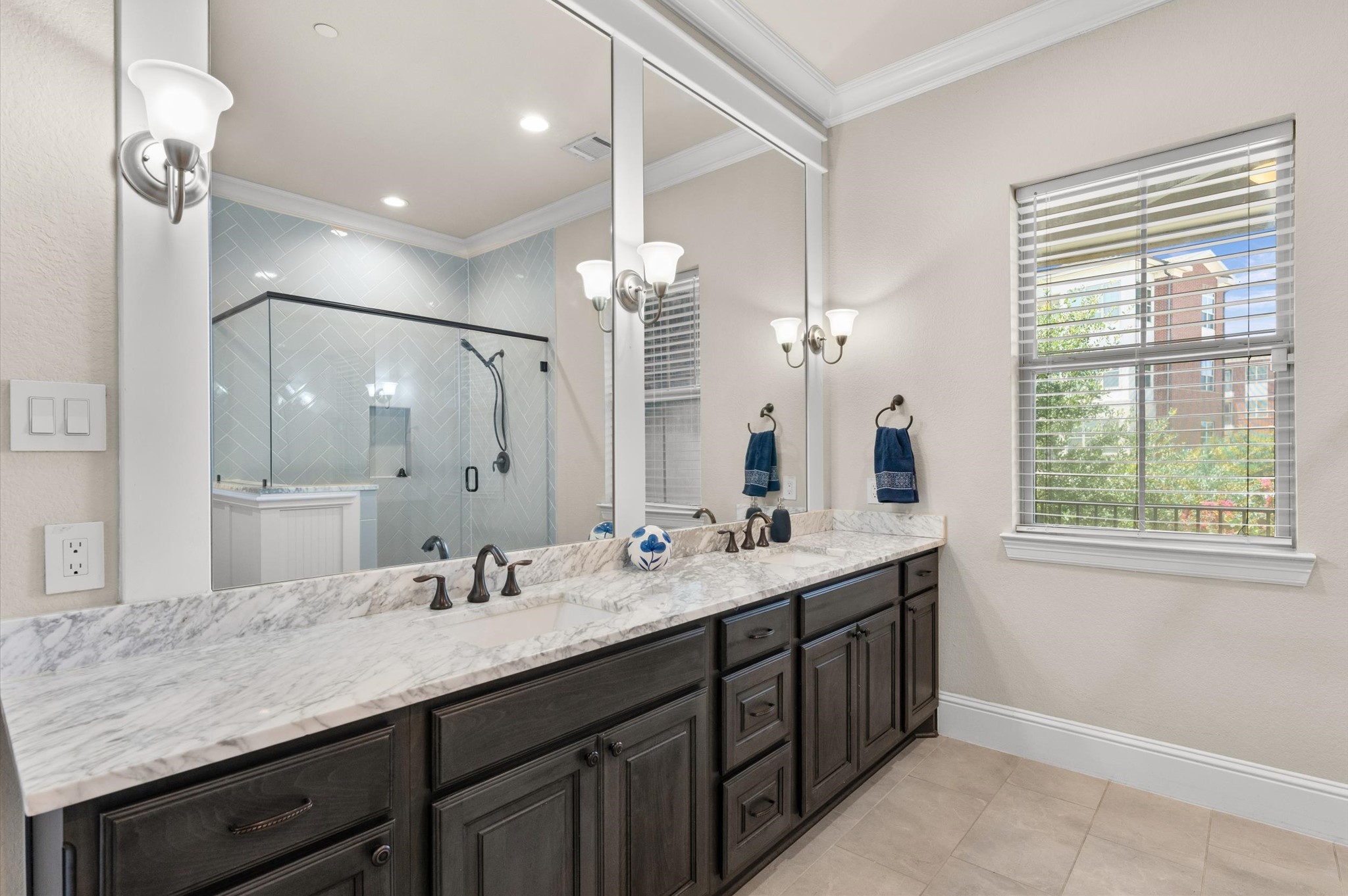 Spacious primary bathroom featuring a dual vanity sink.