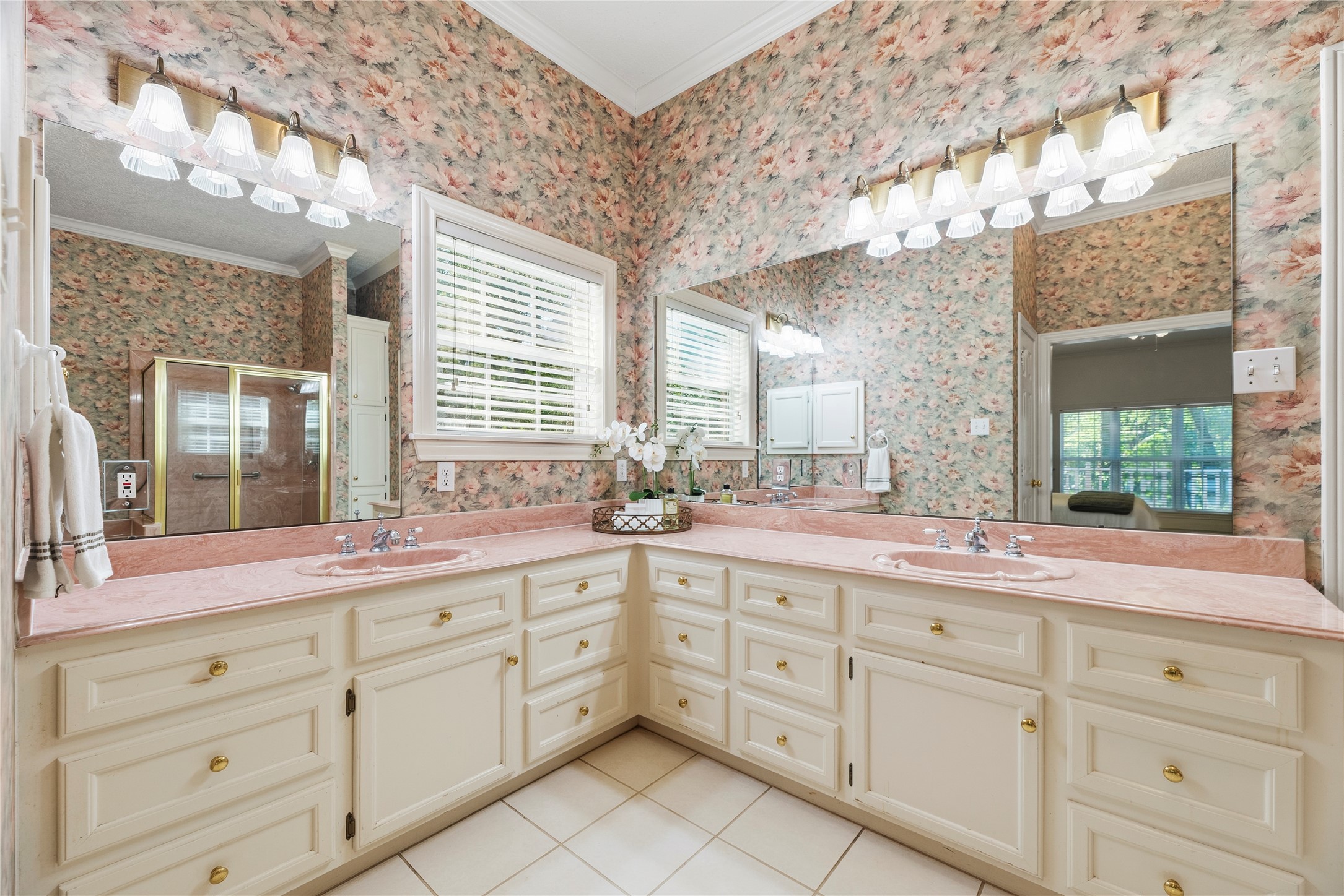 The primary bathroom features dual sinks.