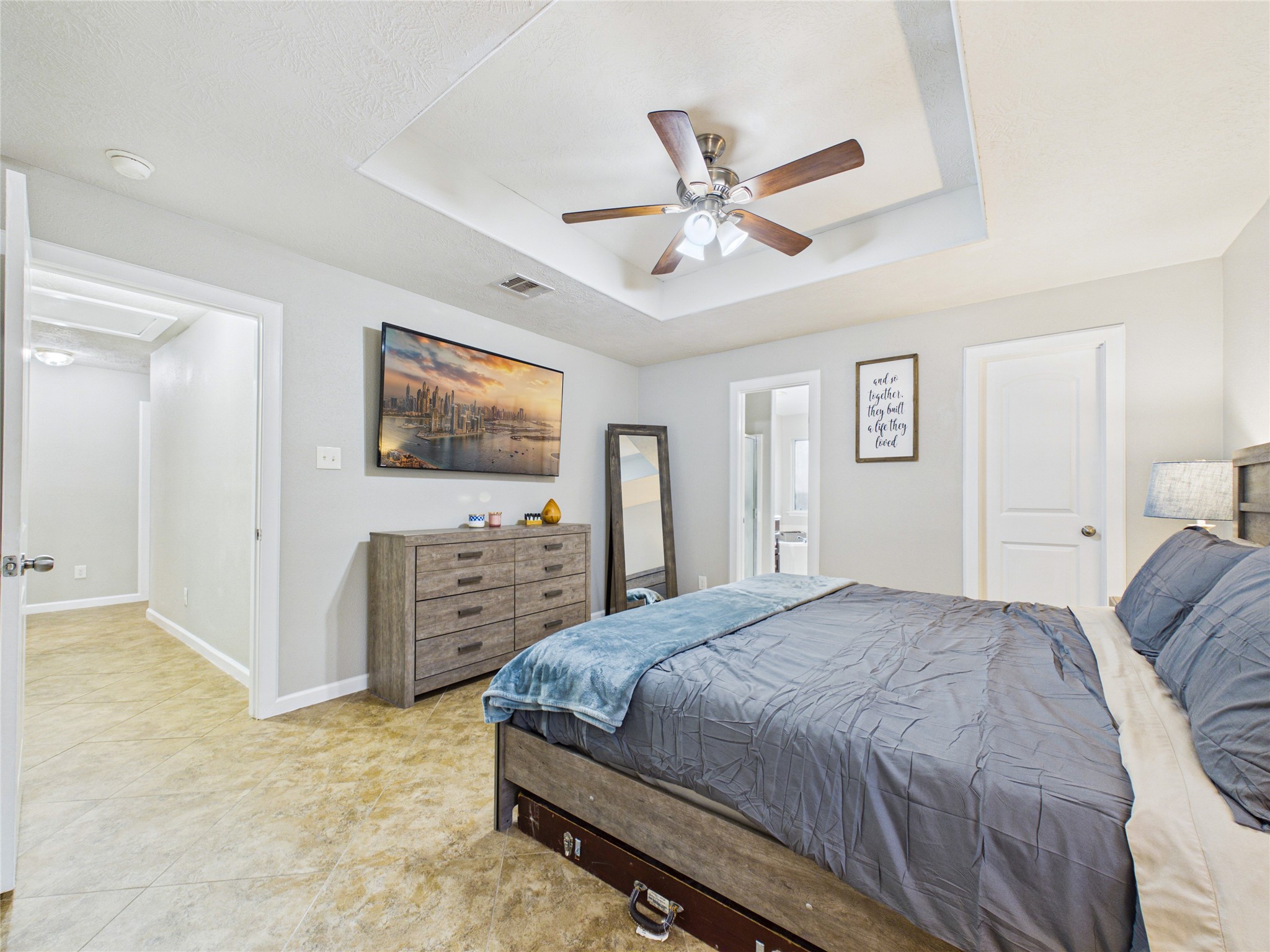 Very spacious primary bedroom with tile and fresh paint continued.