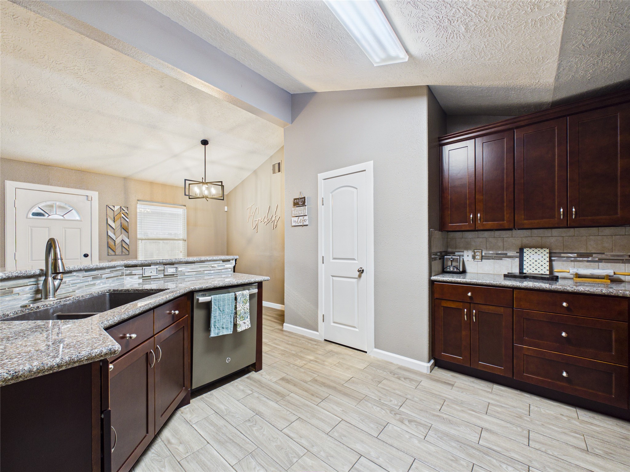 A spacious kitchen featuring storage and a nice size pantry.