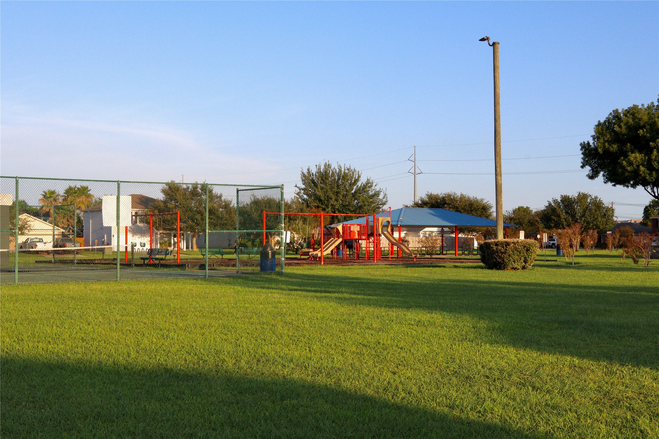 Neighborhood tennis courts, playground, and gazebo.
