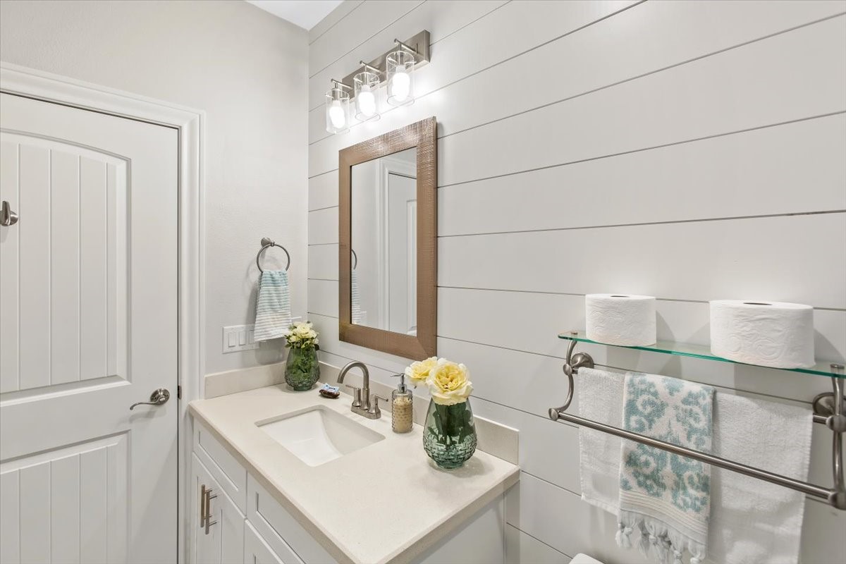 Shiplap walls and nice vanity.
