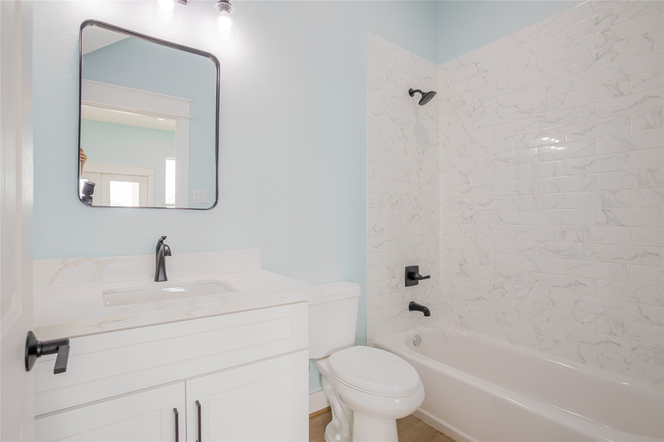 White bath with contemporary black accents