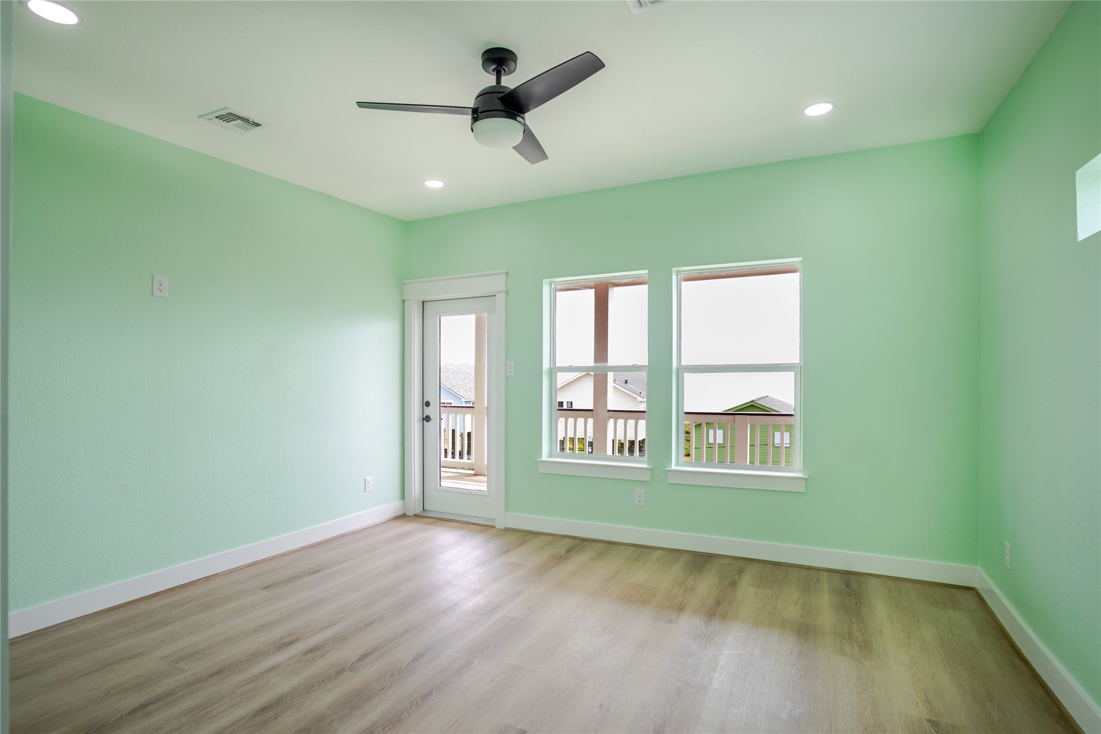 Windows and views galore from this bedroom!
