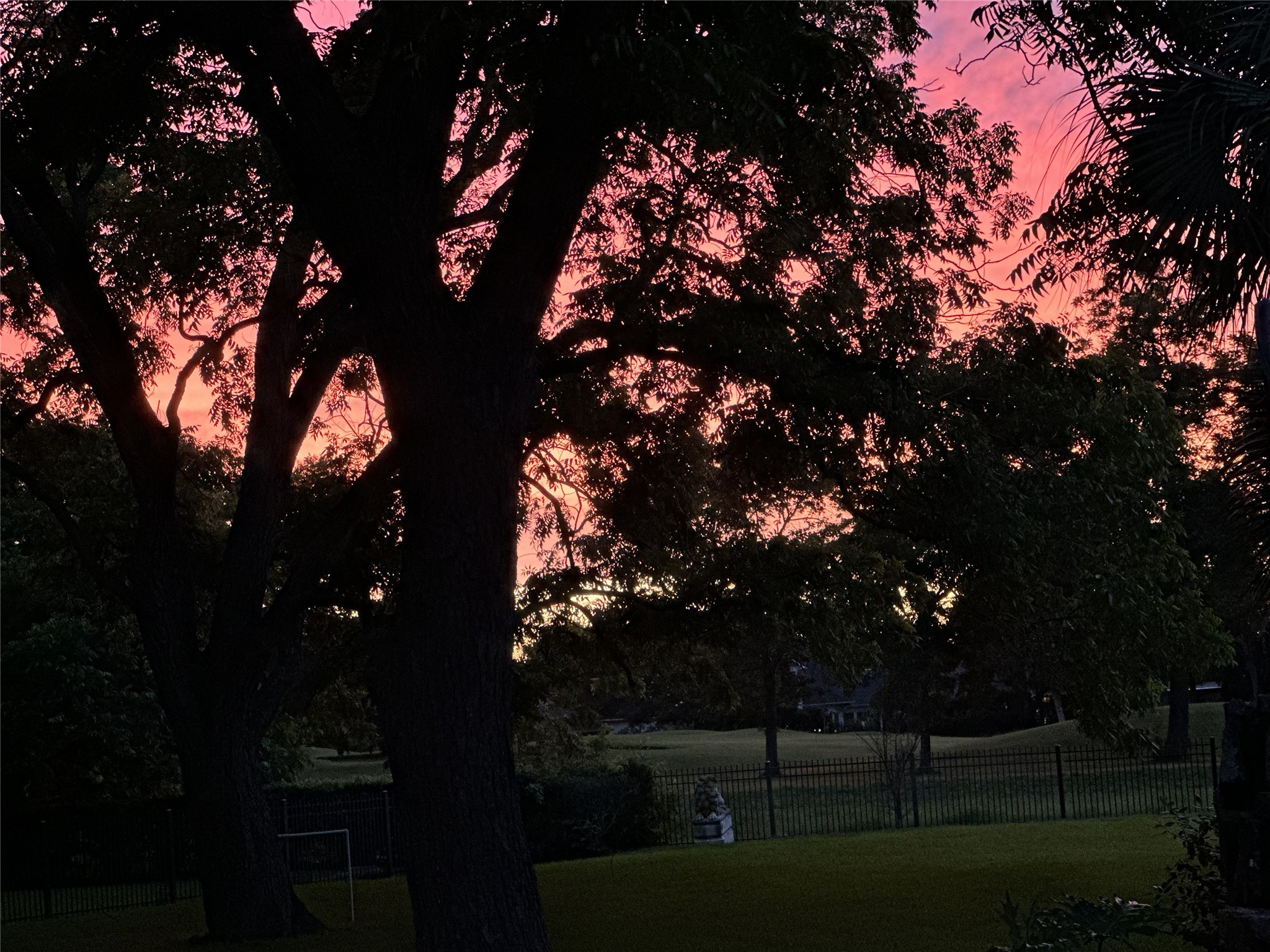 A sunset view from the backyard looking out to the golf course.
