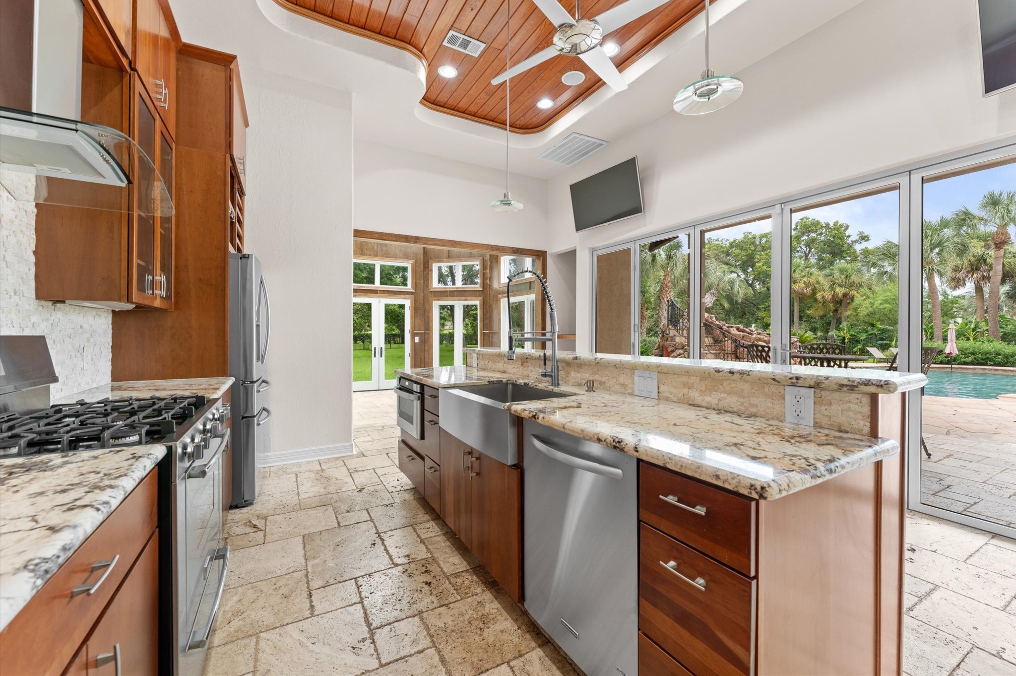 The cabana has a gourmet kitchen, gorgeous finishes, upgraded granite, tongue & groove wood ceiling, custom bifold sliding doors, full bathroom and travertine floors.