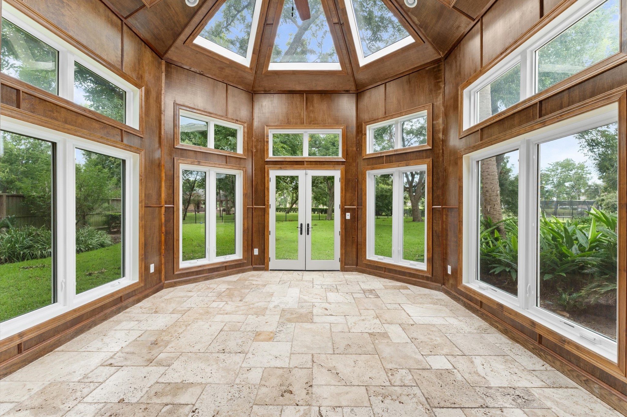 Off of the kitchen in the Cabana is the sunroom which allows you to see the backyard, the golf course and the stars at night. The possibilities in this room are endless!