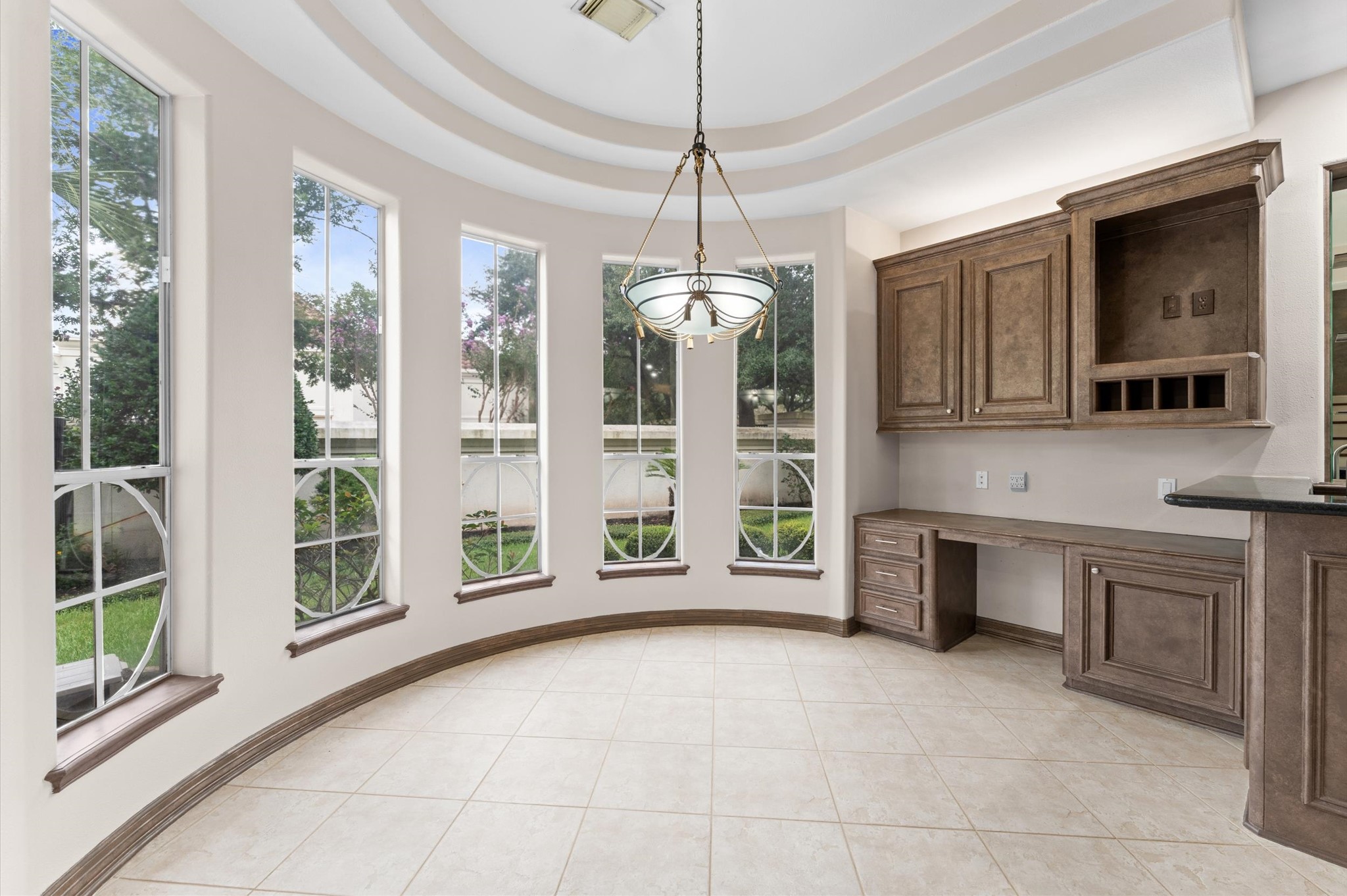 A view of the breakfast area and the custom windows with built-in desk.