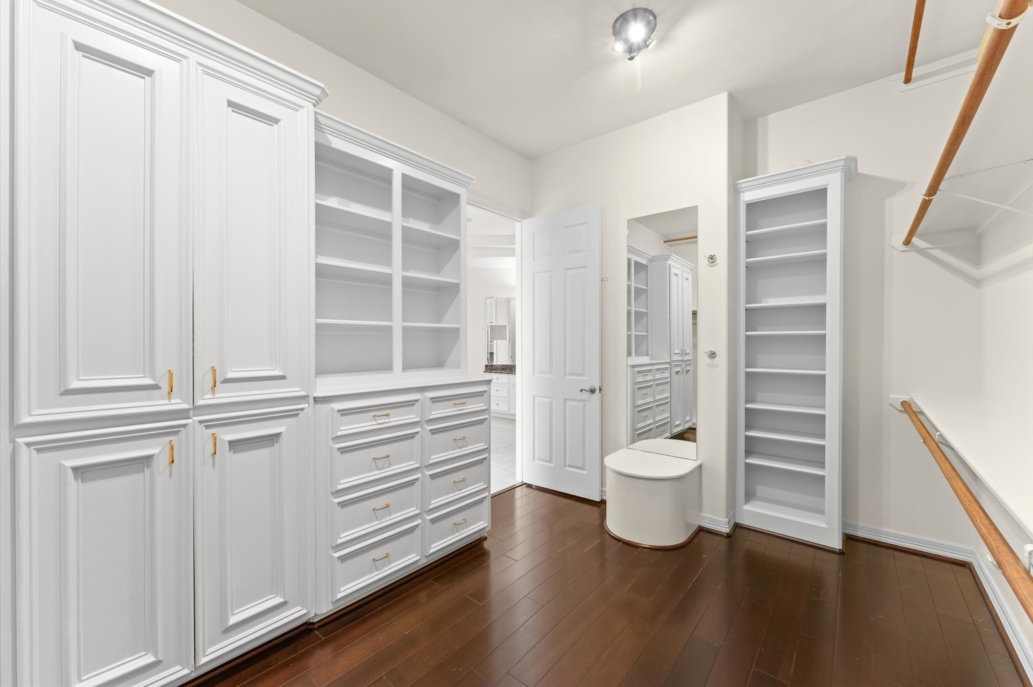 A peak into Closet No. 1 in the primary bedroom.