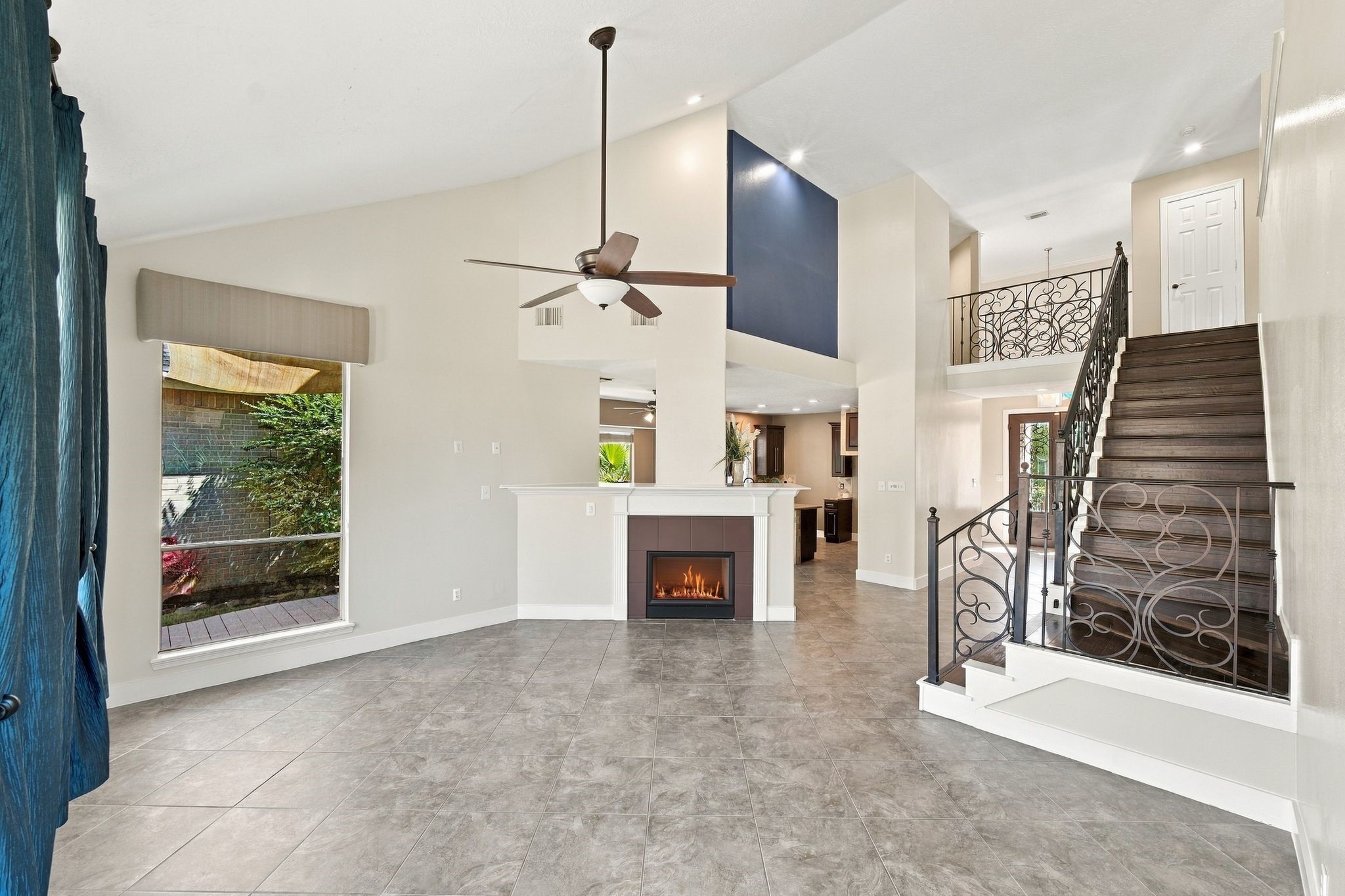 Gather around the inviting fireplace in this elegant living space, perfect for cozy evenings and creating lasting memories.