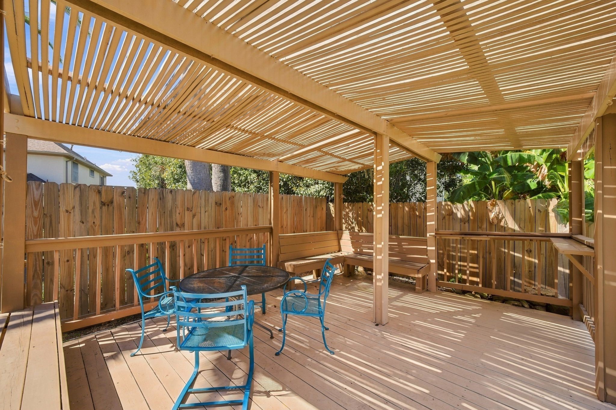 Unwind in your private oasis under the inviting backyard pergola, perfect for relaxation and gatherings.