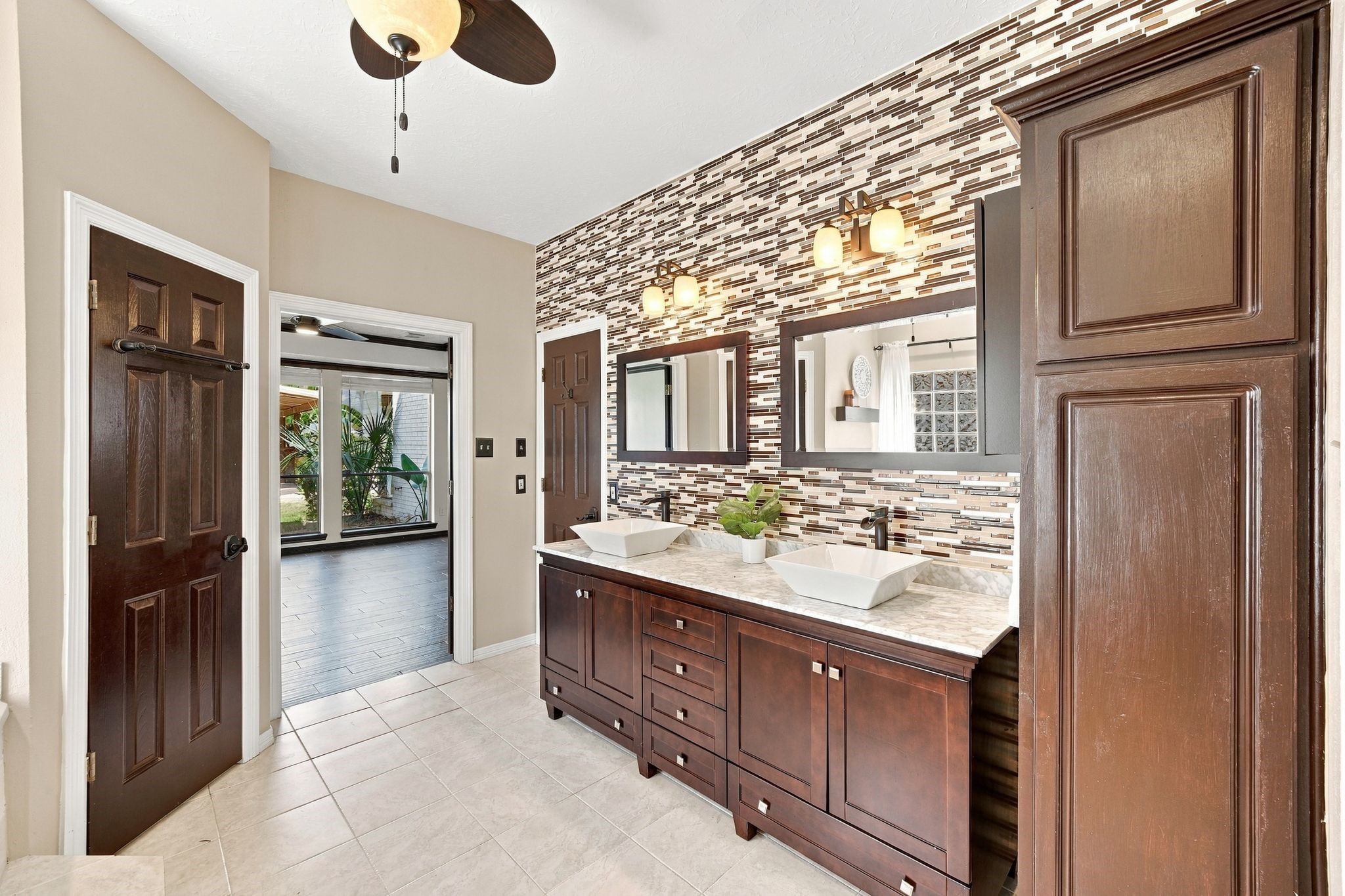 Experience luxury in the primary bathroom with elegant double sinks and abundant storage, perfect for a seamless morning routine.