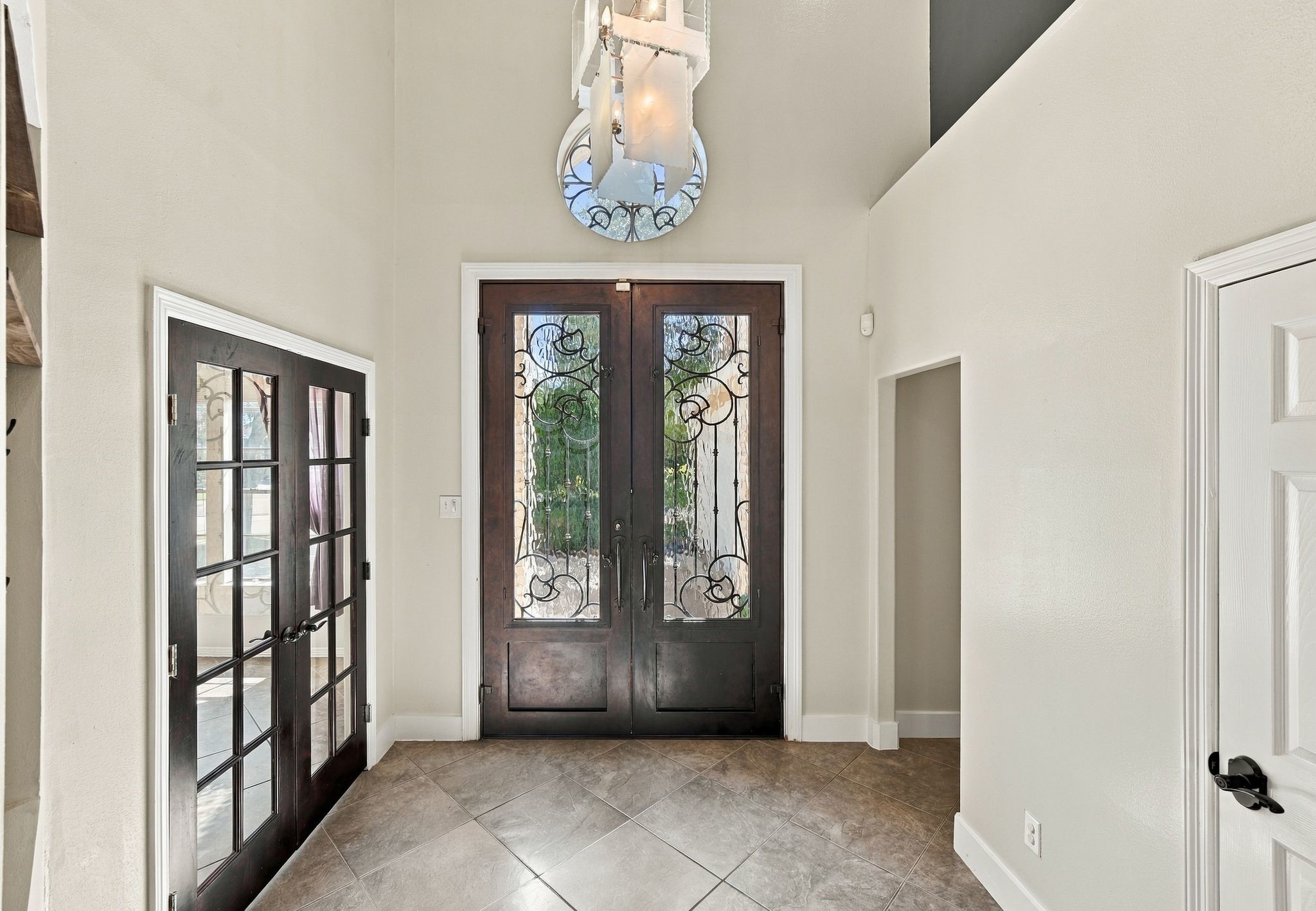 Step into a welcoming foyer with soaring high ceilings, setting an elegant tone for the rest of the home.