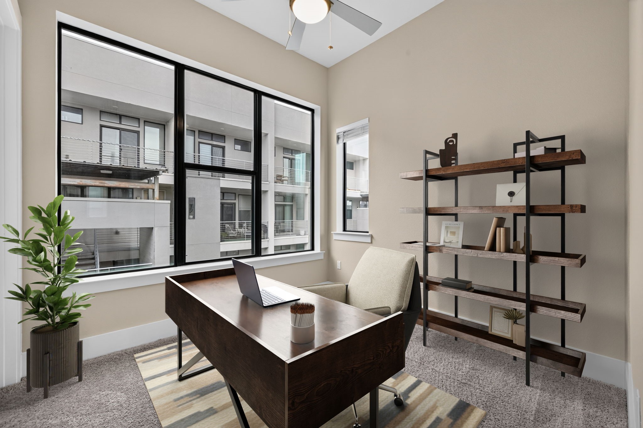 The 3rd secondary bedroom can also be ussed as an office with it's oversized windows. The room features a huge walk in closet and en-suite bath. Photo is virtually staged