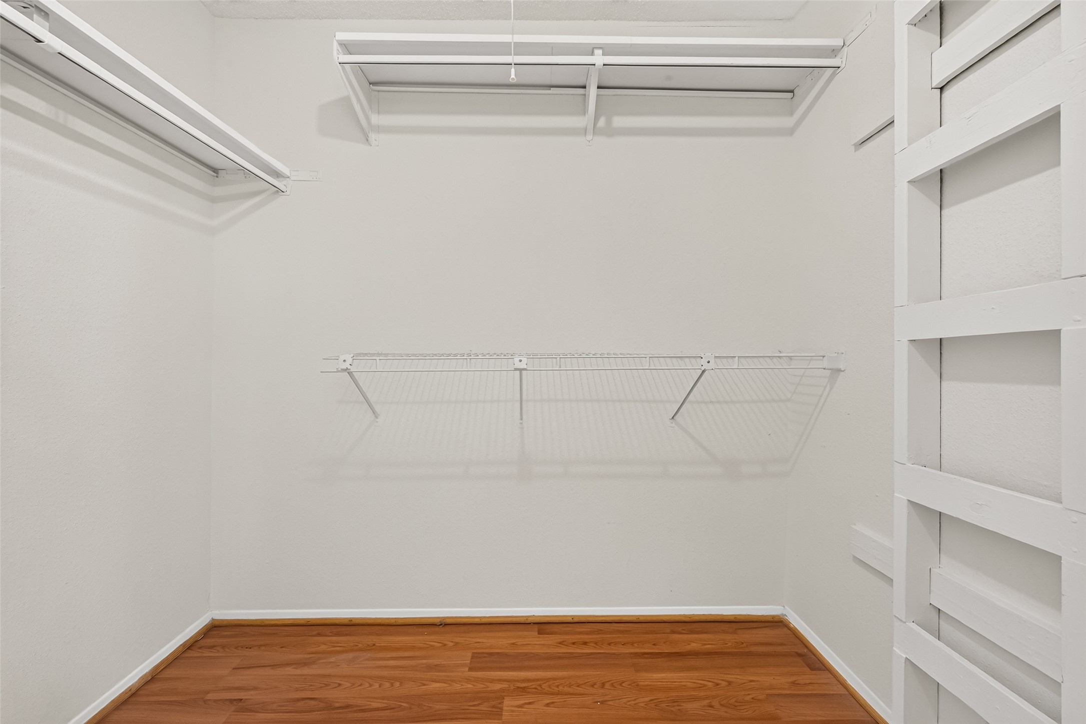 Spacious walk-in closet and ample hanging space for organized storage.