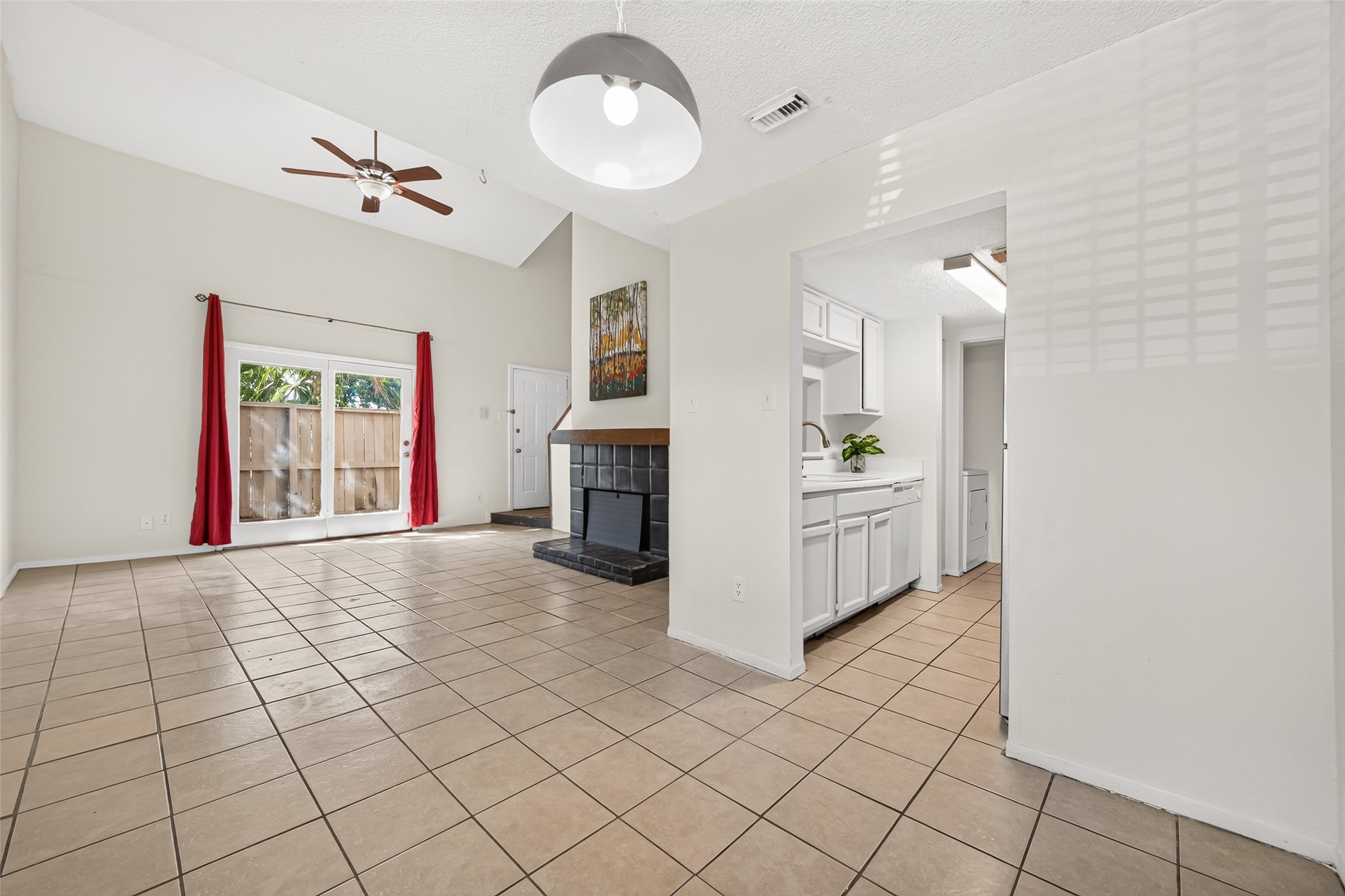 This pic show another view of kitchen , and ample living area.