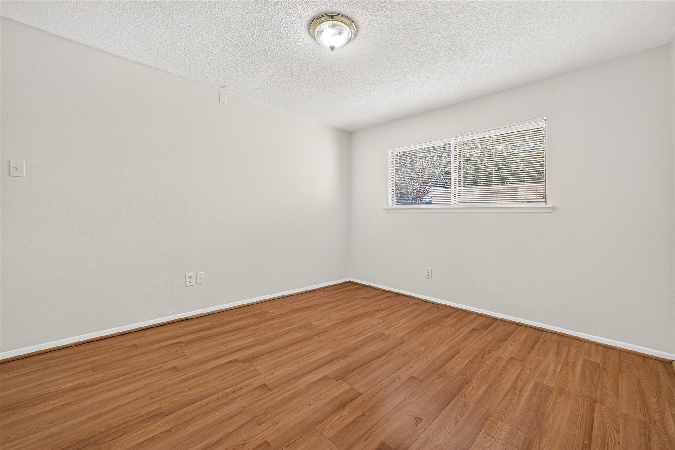 Another view of primary bedroom.