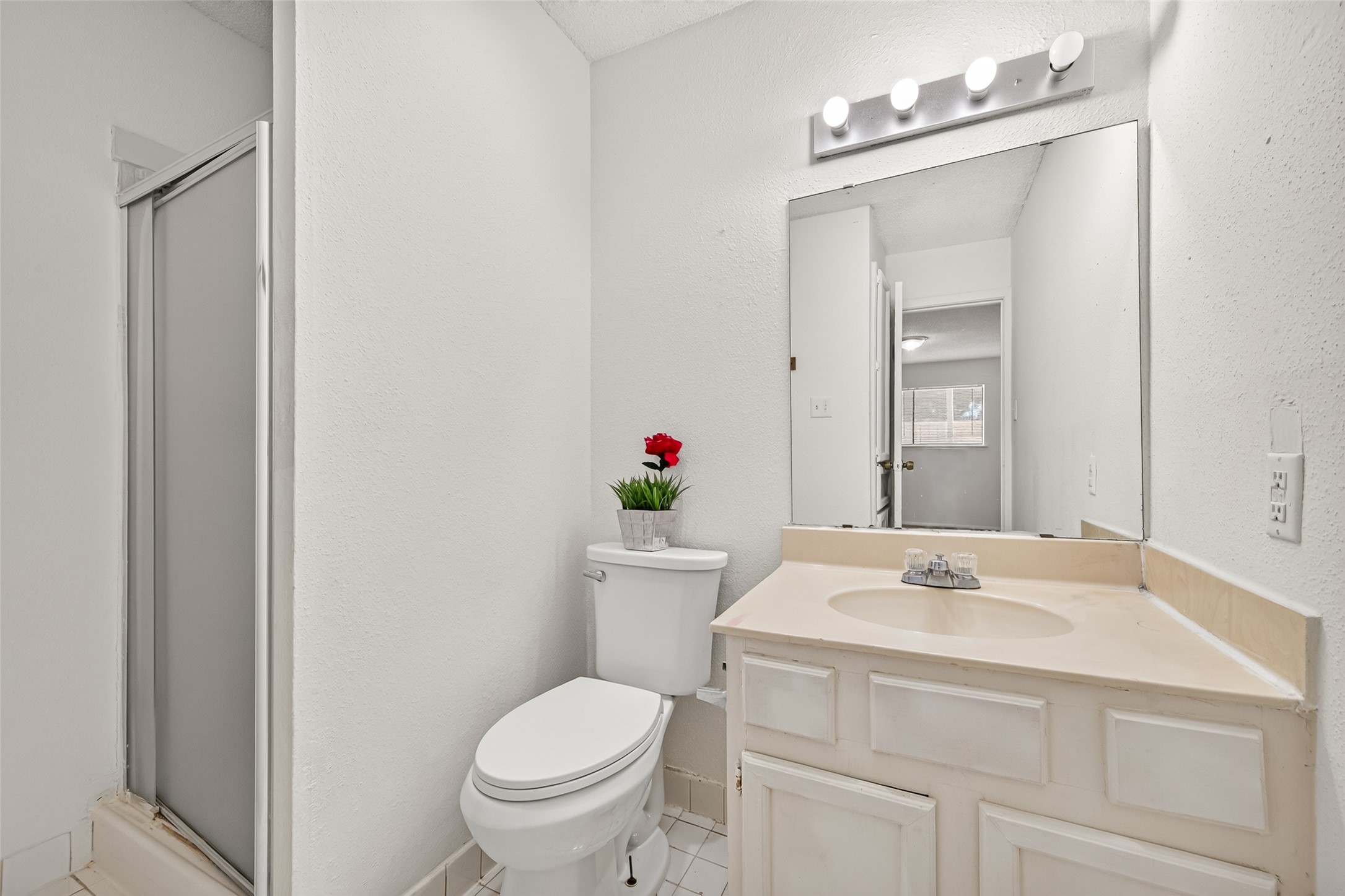 First floor primary bathroom with shower.
