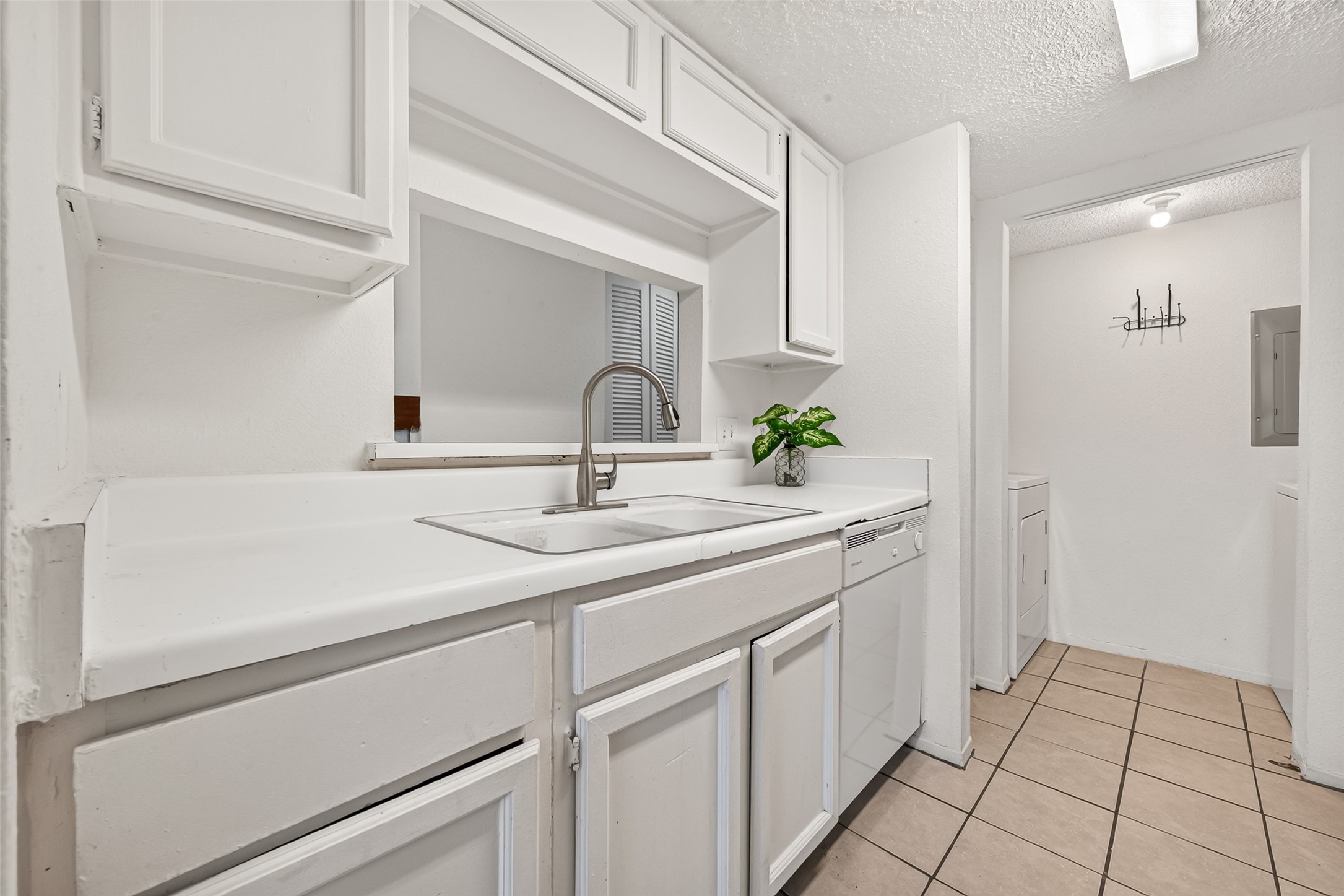 this pic show the Convenient laundry room equipped with washer and dryer.