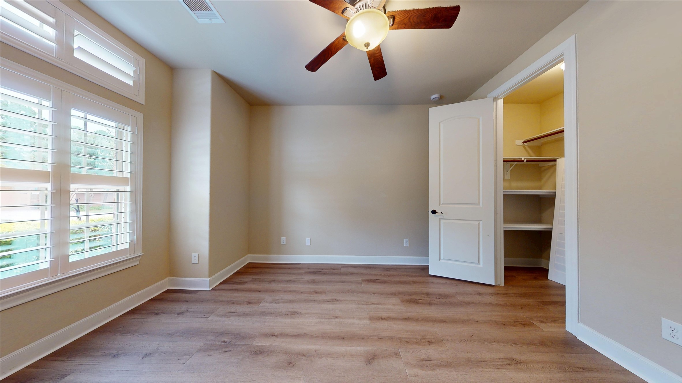 Bedroom at front of house with large walk in closet