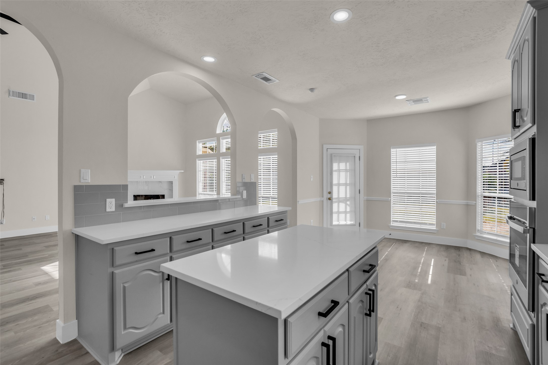 Large windows and archways enhance the open feel of the breakfast area