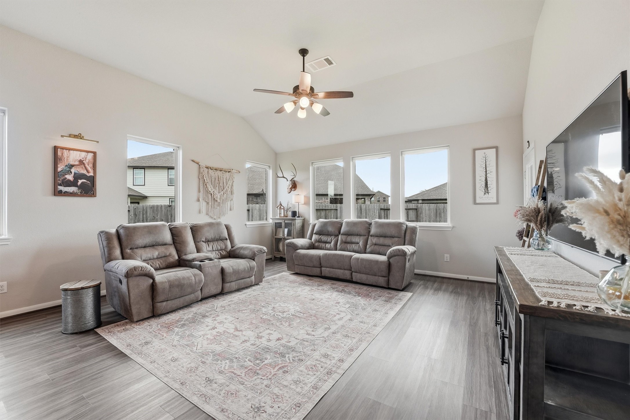 Bright and spacious living room with high ceilings.
